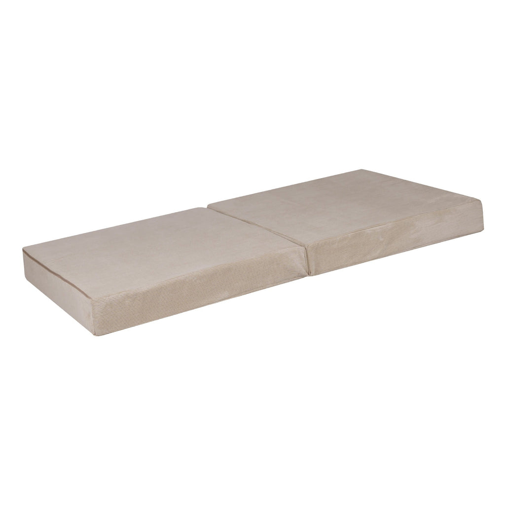 a child's ecru corduroy sofa with two poufs arranged for a cozy afternoon nap
