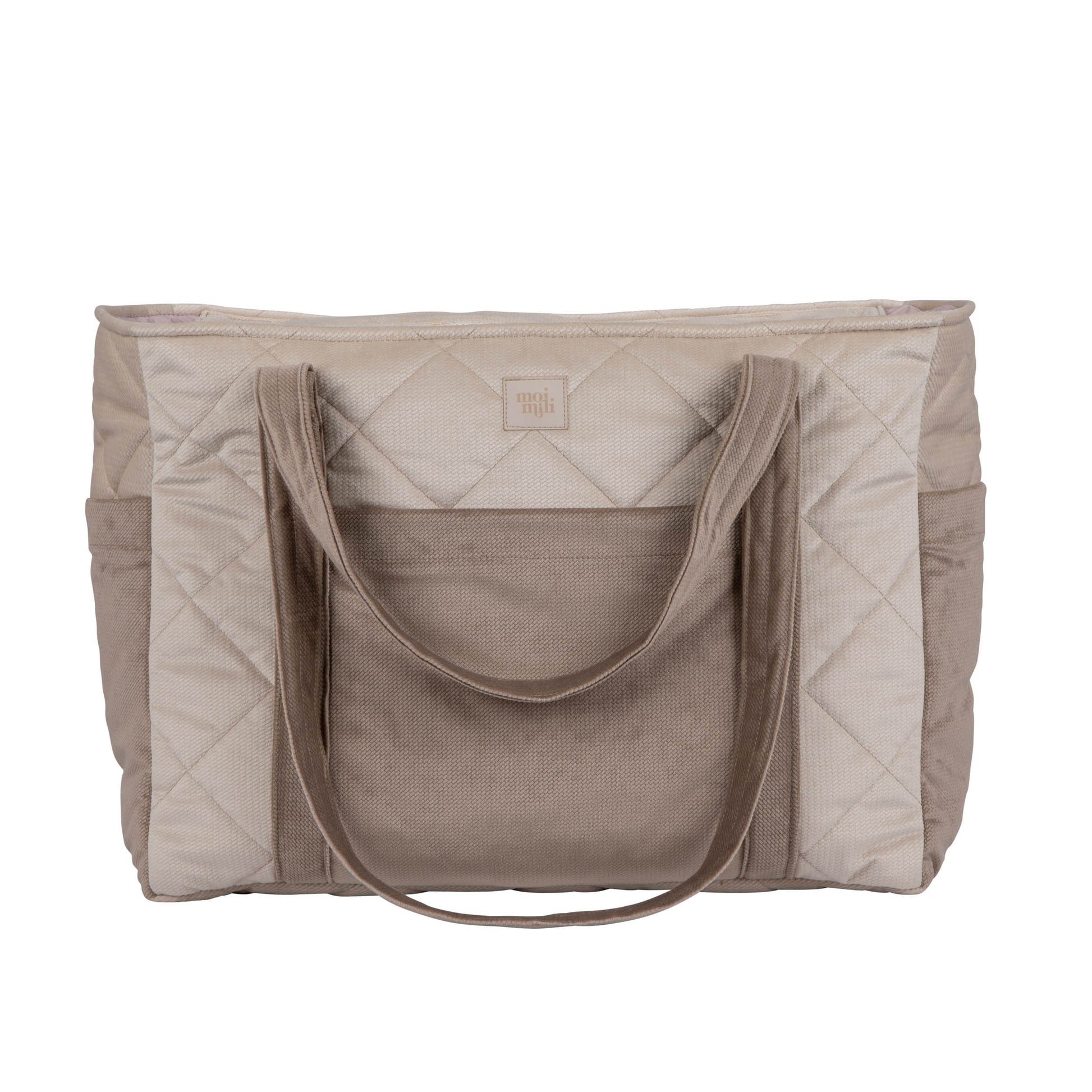 playful beige weekender bag on a sunny park bench, straps askew and ready for a spontaneous adventure