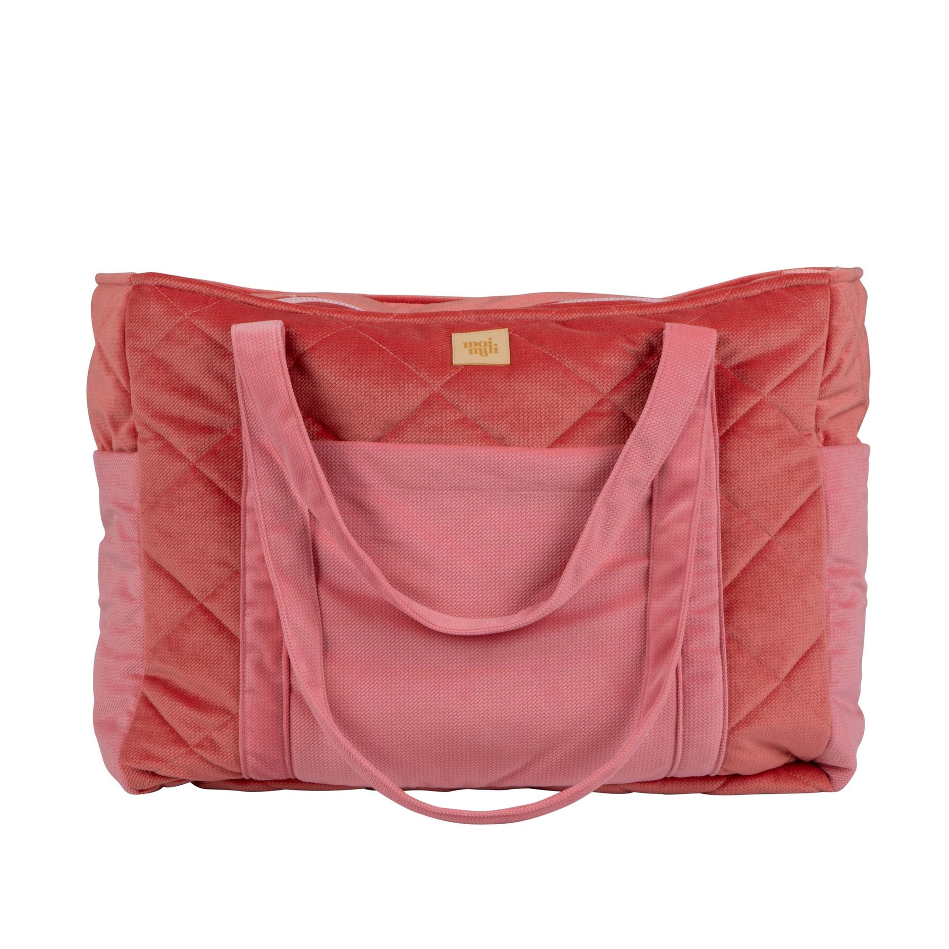 practical weekender bag with multiple pockets open on a table, ready for an organized day out