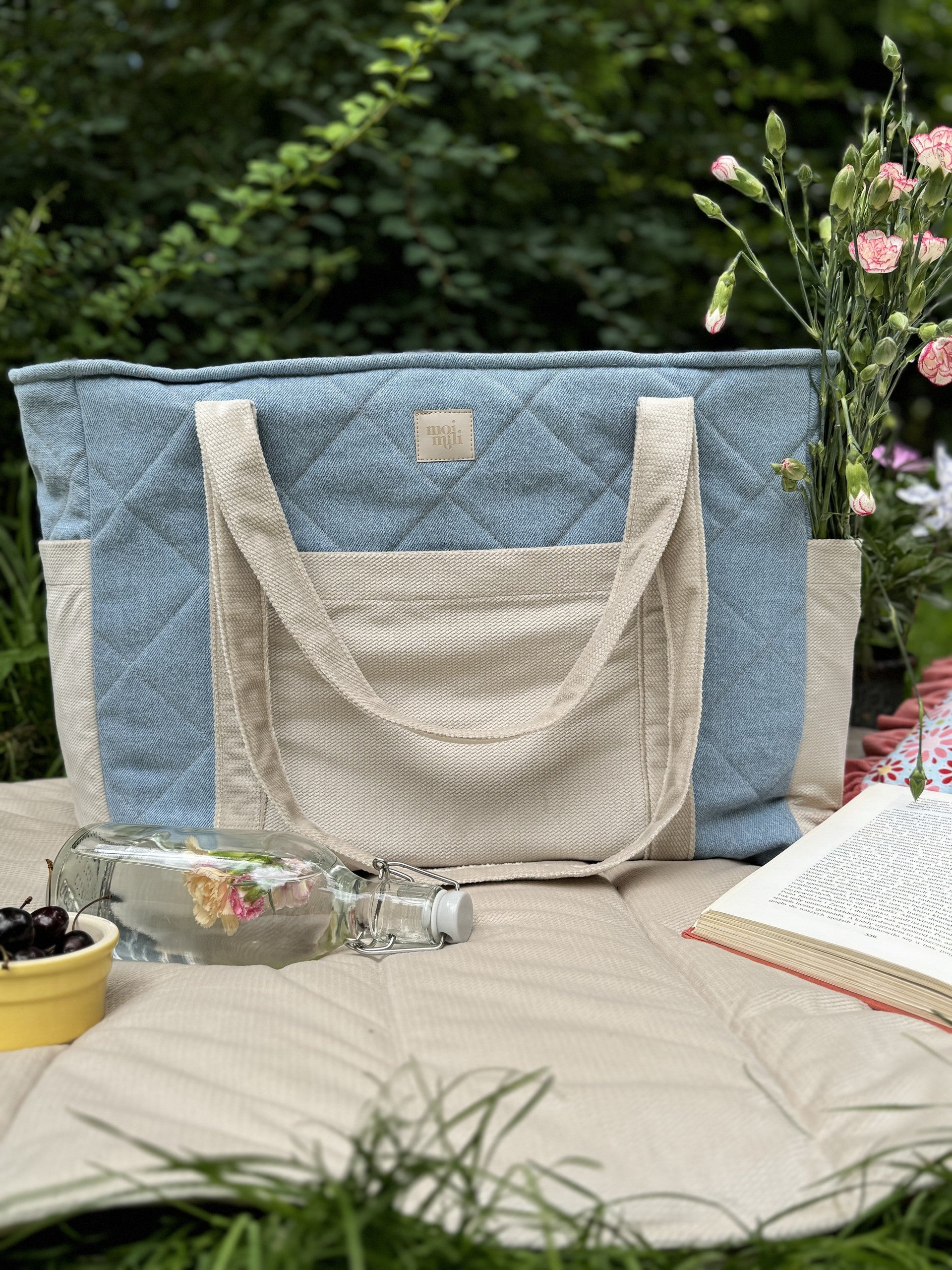 confident woman carrying a chic handmade denim weekender bag on her shoulder