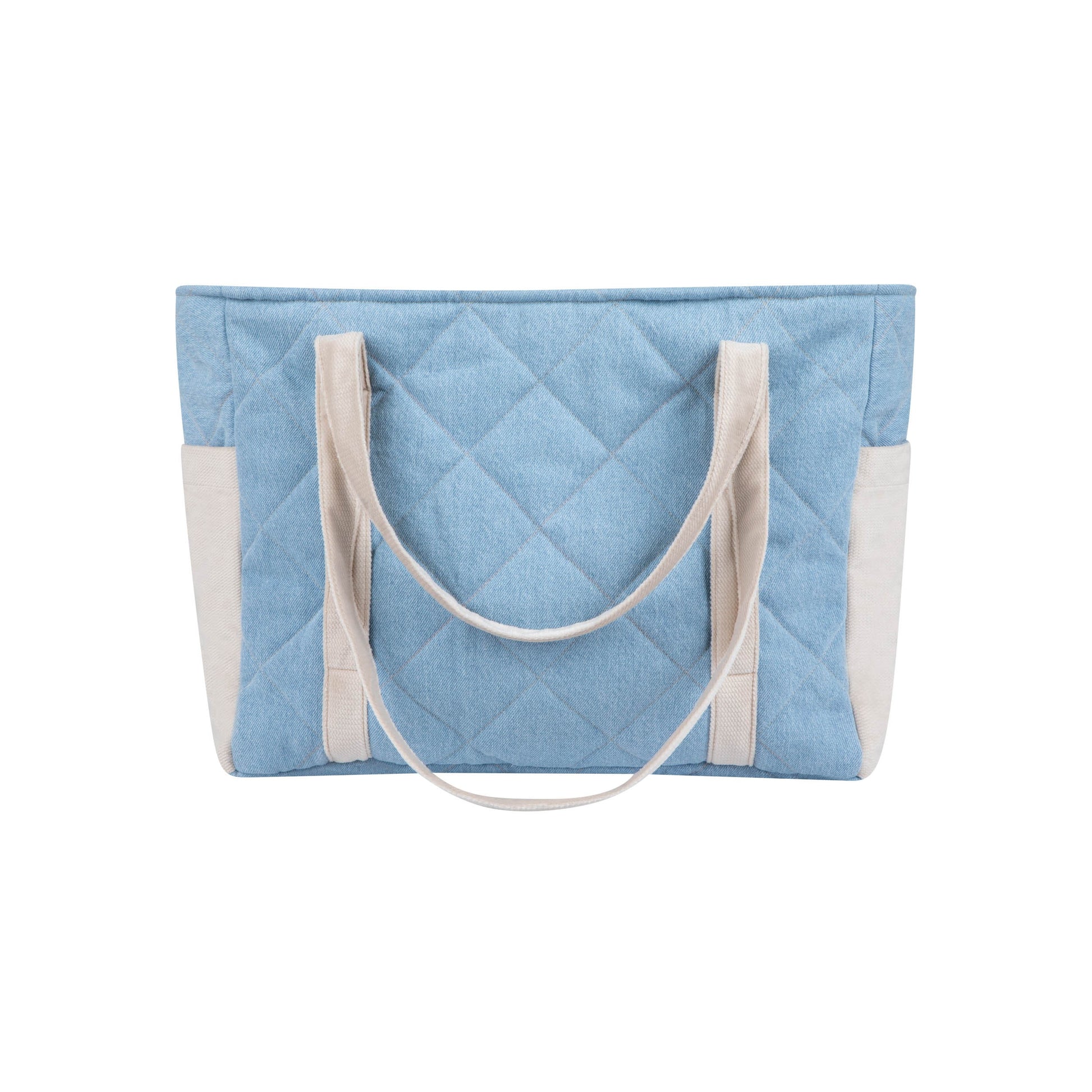 a practical denim weekender bag with multiple pockets open on a park bench
