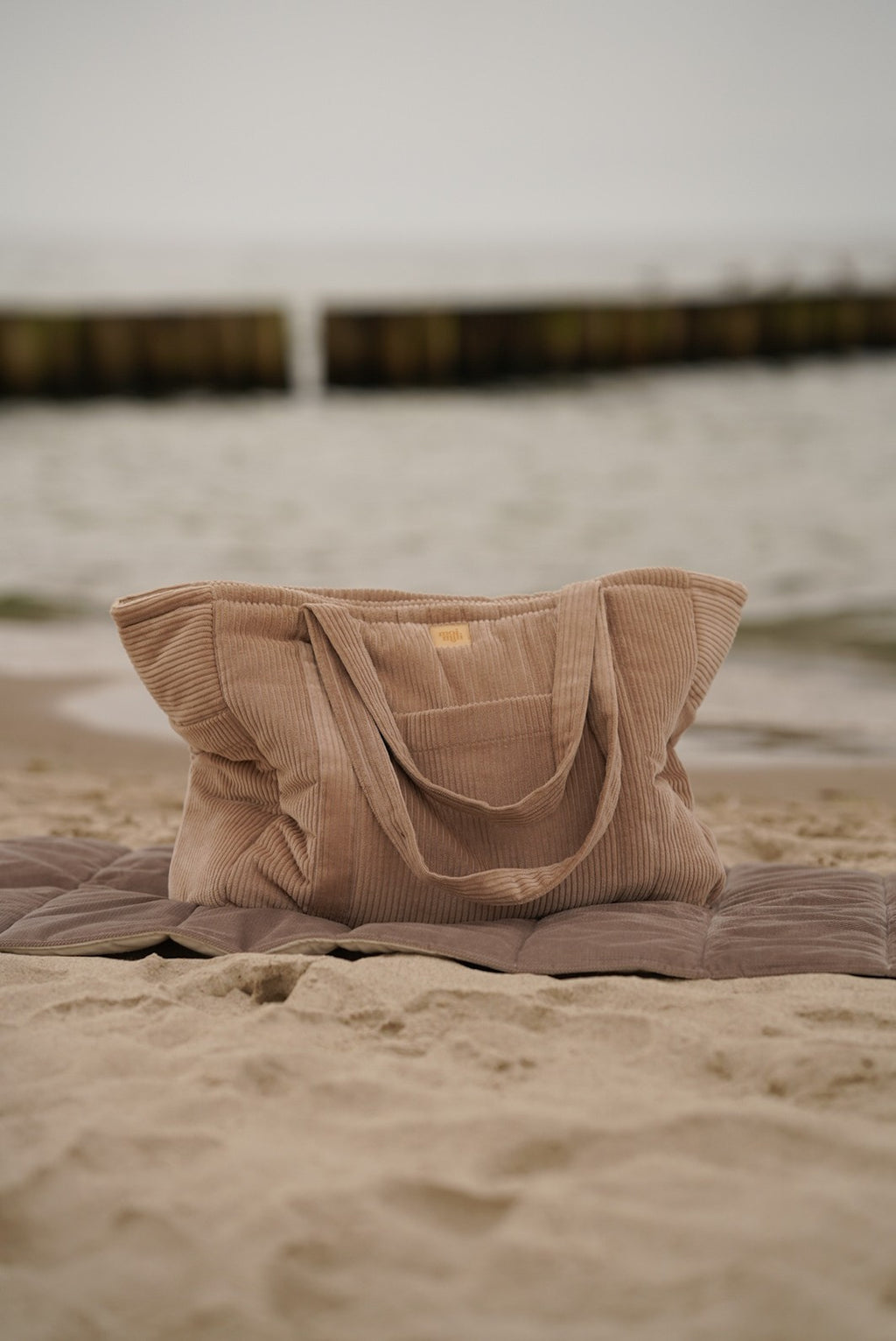 practical latte weekender bag with waterproof lining and multiple pockets for travel
