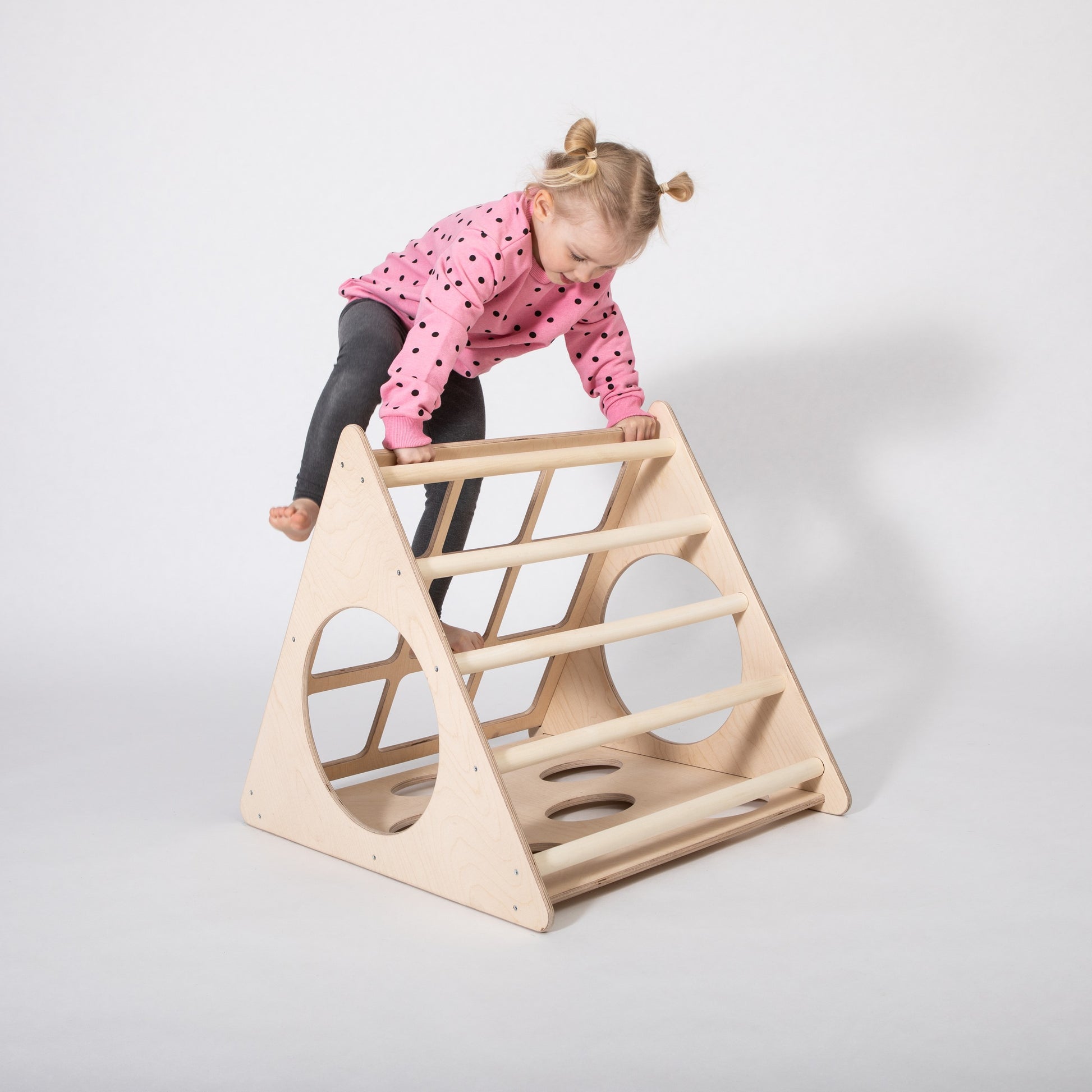 a functional montessori 3-angle climber shown with assembly tools and instructions for easy setup