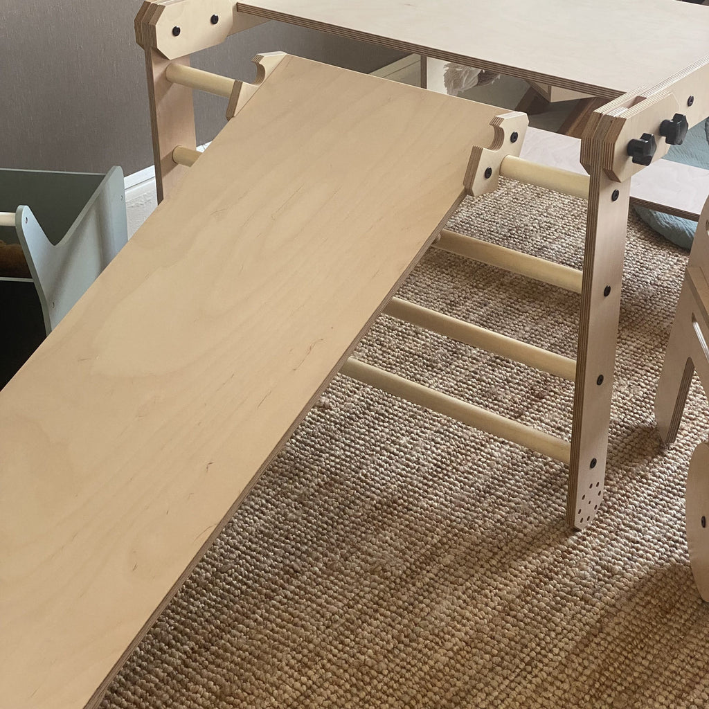 montessori nabu set with whiteboard tabletop and optional slide in a bright, open playroom