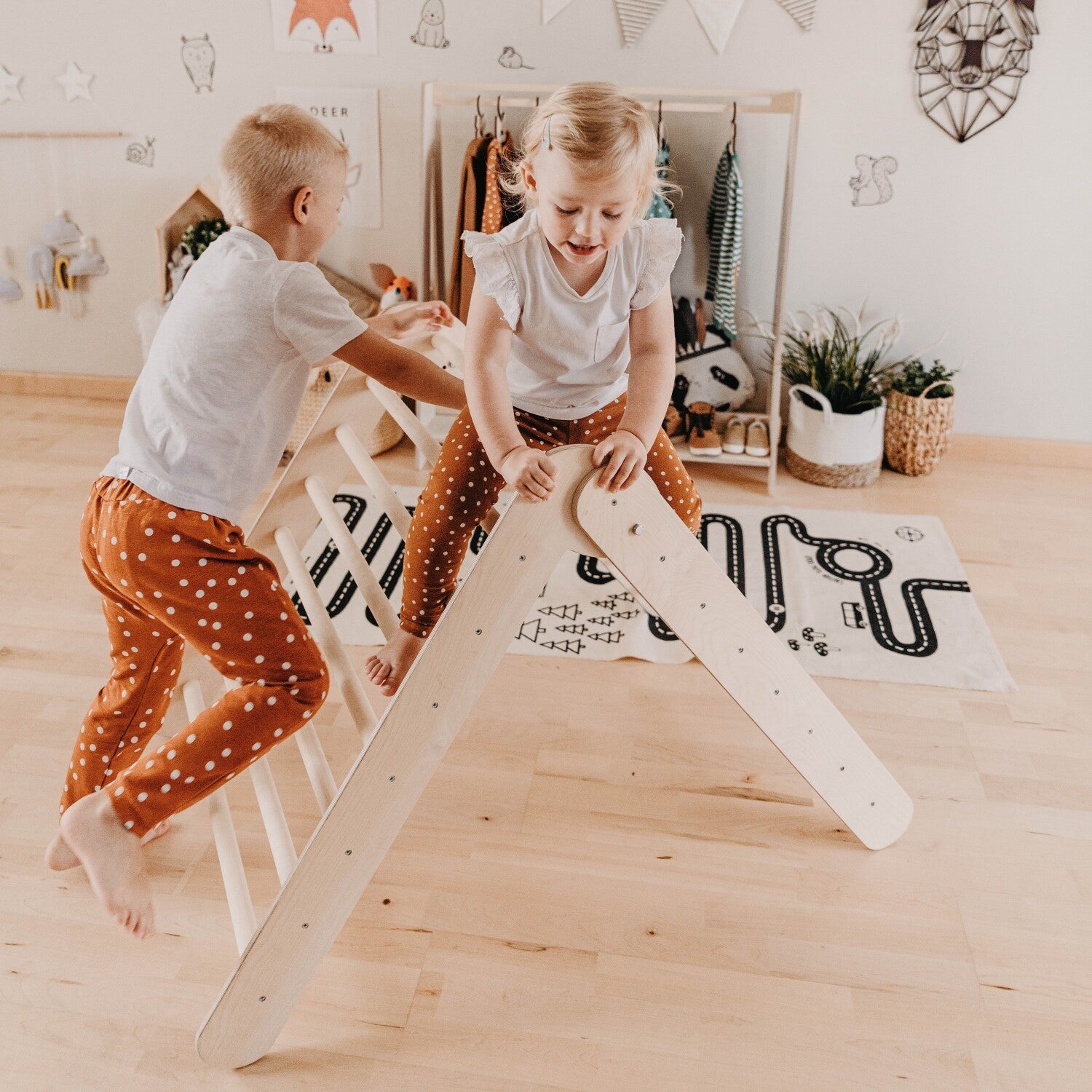 elegant montessori climbing triangle in a minimalist nursery setting