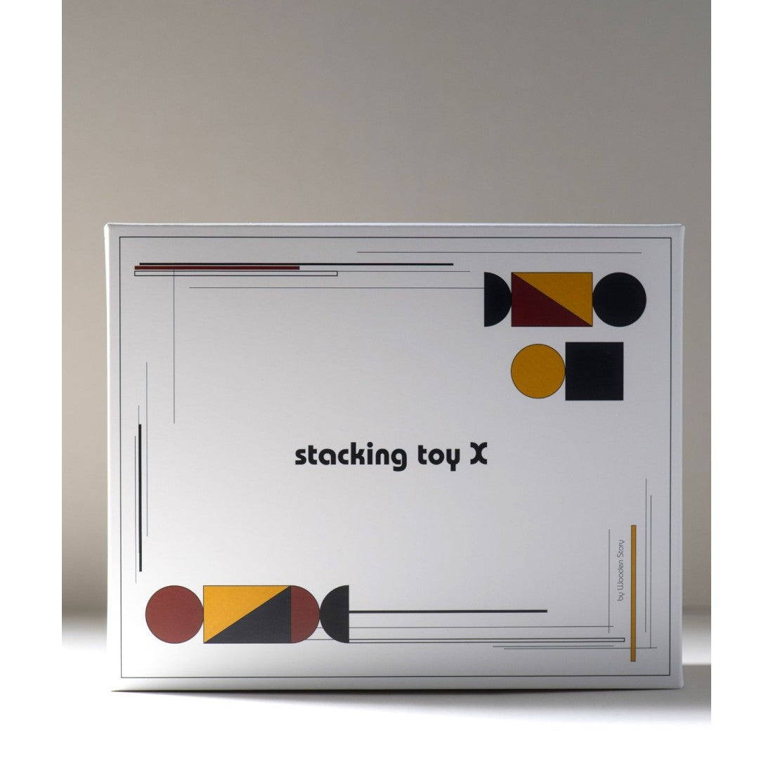 a playful toddler's hand stacking a bauhaus-inspired wooden spaceship