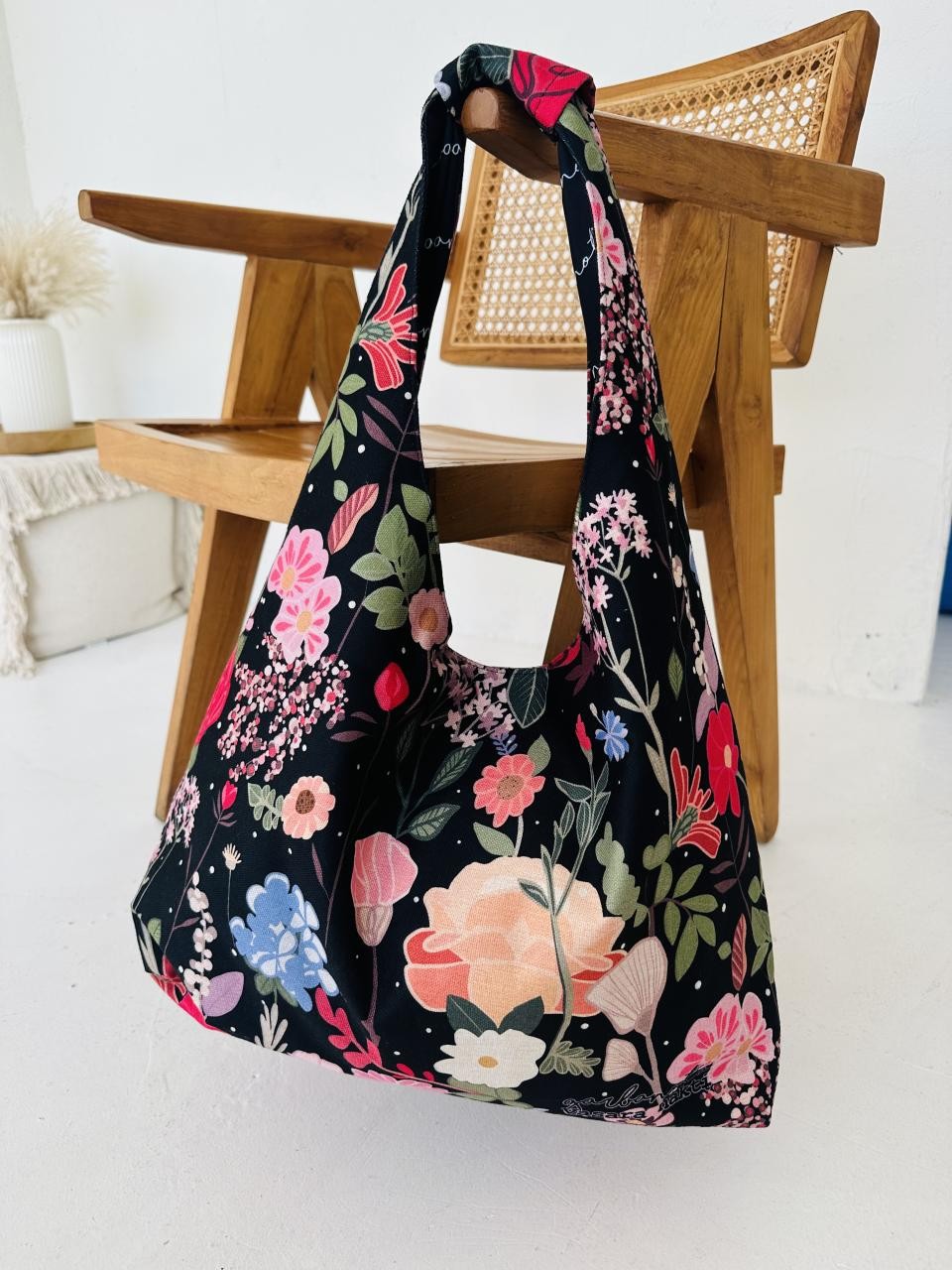 practical moon bag open to show its spacious interior and secure zippered pocket