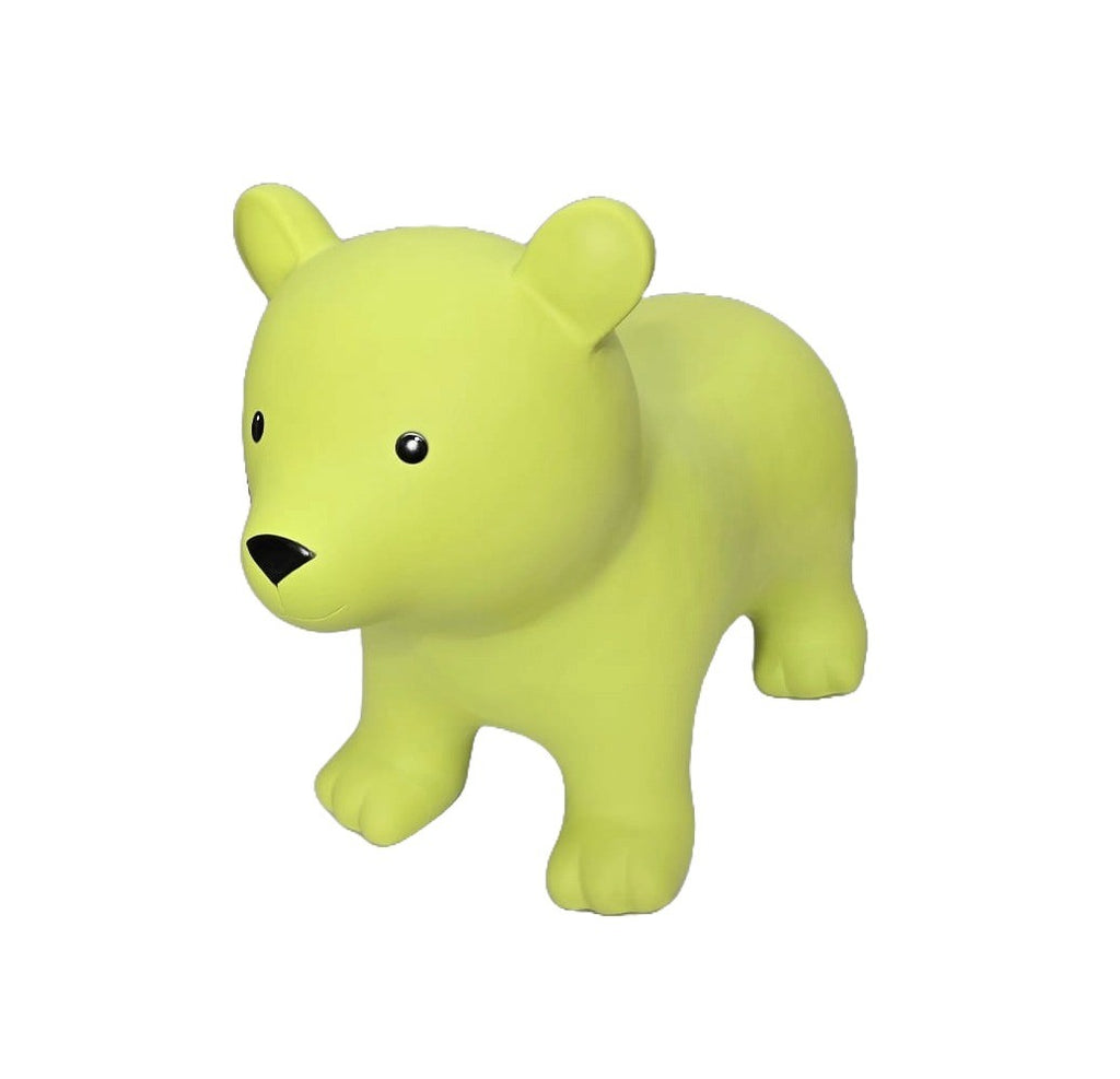 a soft green bear hopper toy sitting gently on a cozy nursery rug