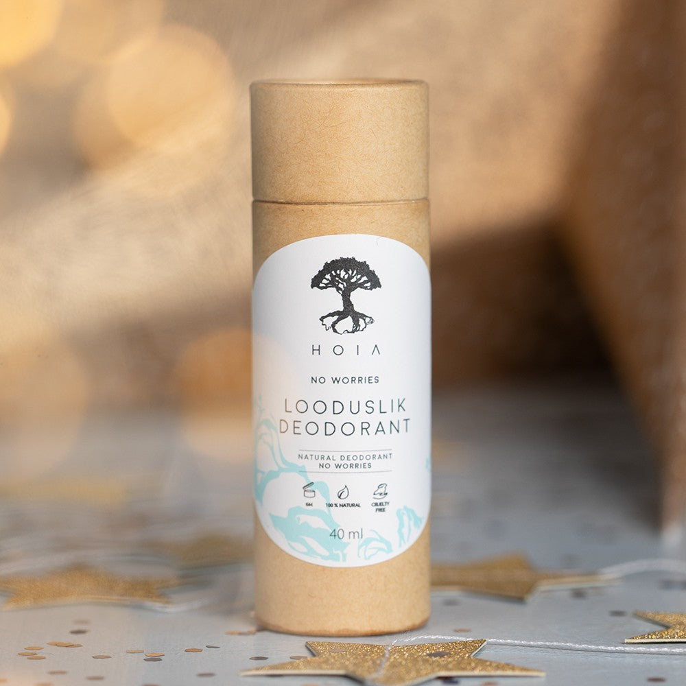 bold close-up of no worries natural deodorant held confidently in hand