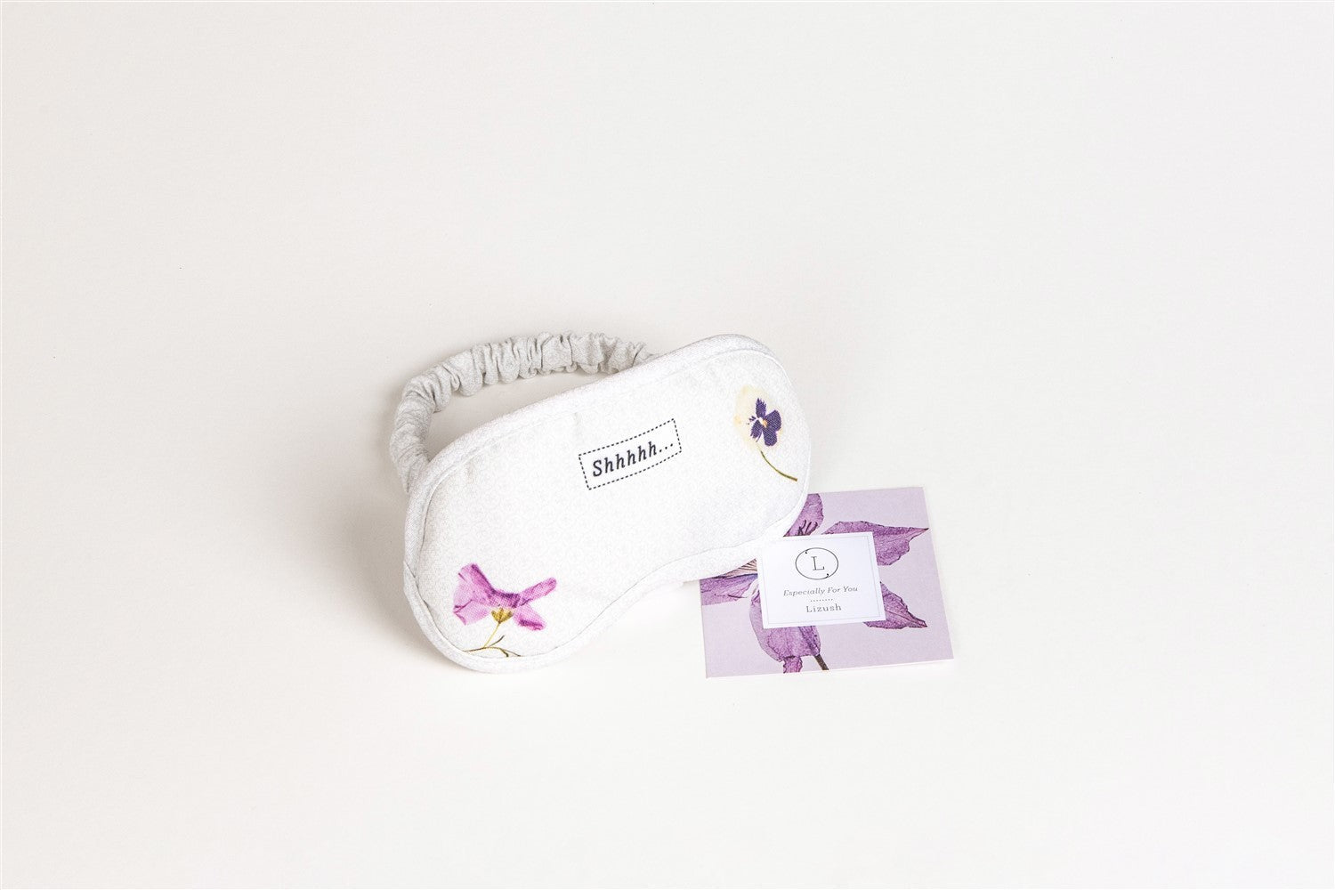 a functional and practical arrangement of the new mom skincare gift set on a rustic wooden surface