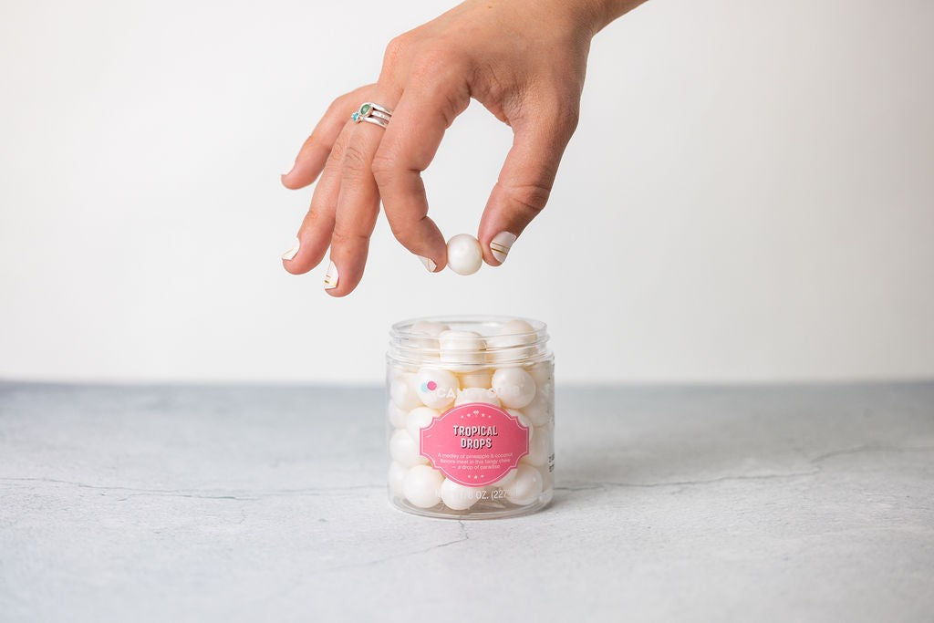 a close-up of the gift set's lavender soap and foot salt on a rustic wooden table