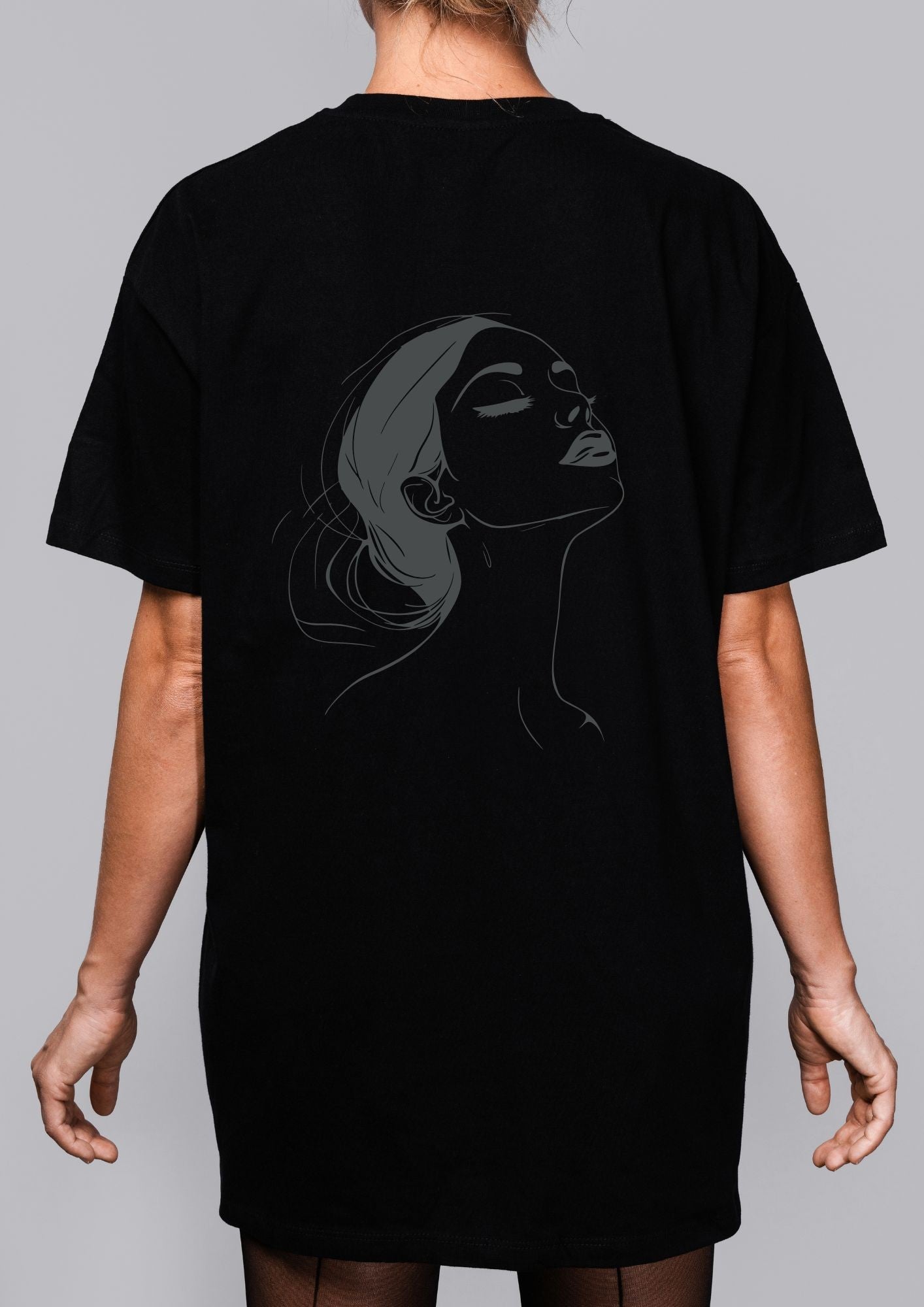 a playful close-up of the no drama please tee, showing the witty back illustration in warm, inviting light