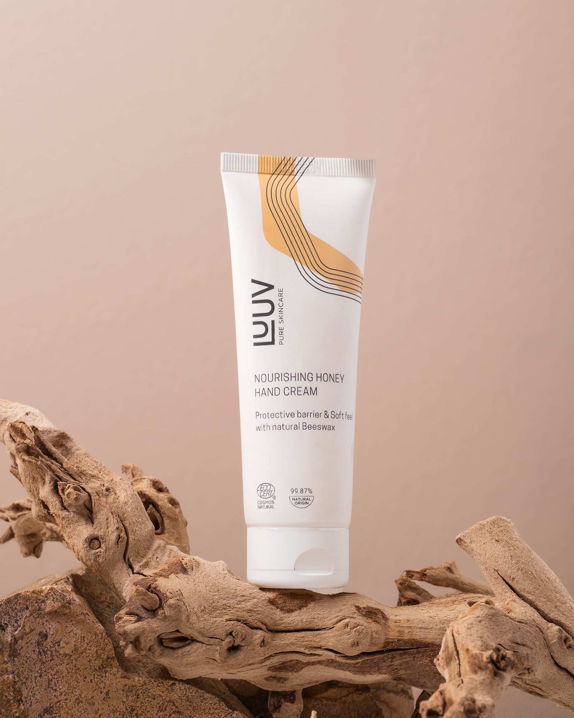 a playful dollop of honey hand cream about to be scooped, glowing with natural light