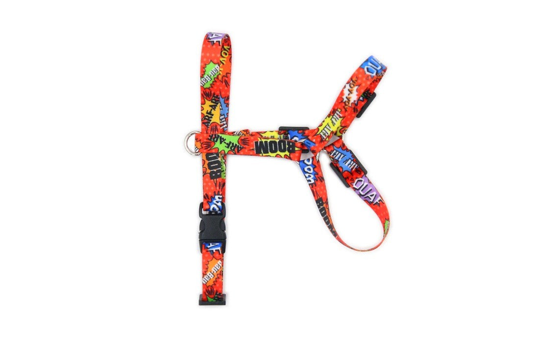 elegant red graffiti nylon dog harness with polished nickel fittings on a refined dark background