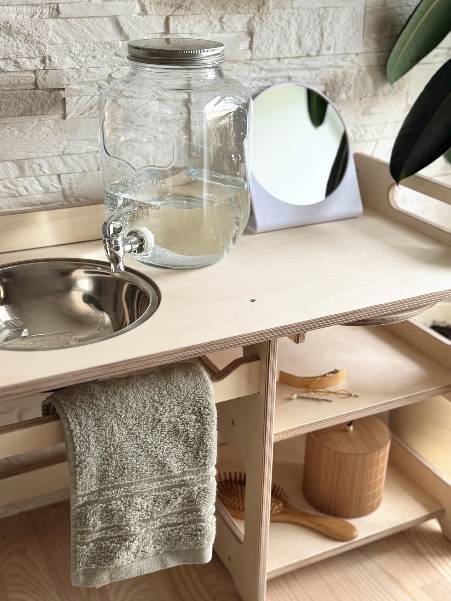 montessori wooden washbasin with storage shelf and enamel bowl in a bright, practical home setting