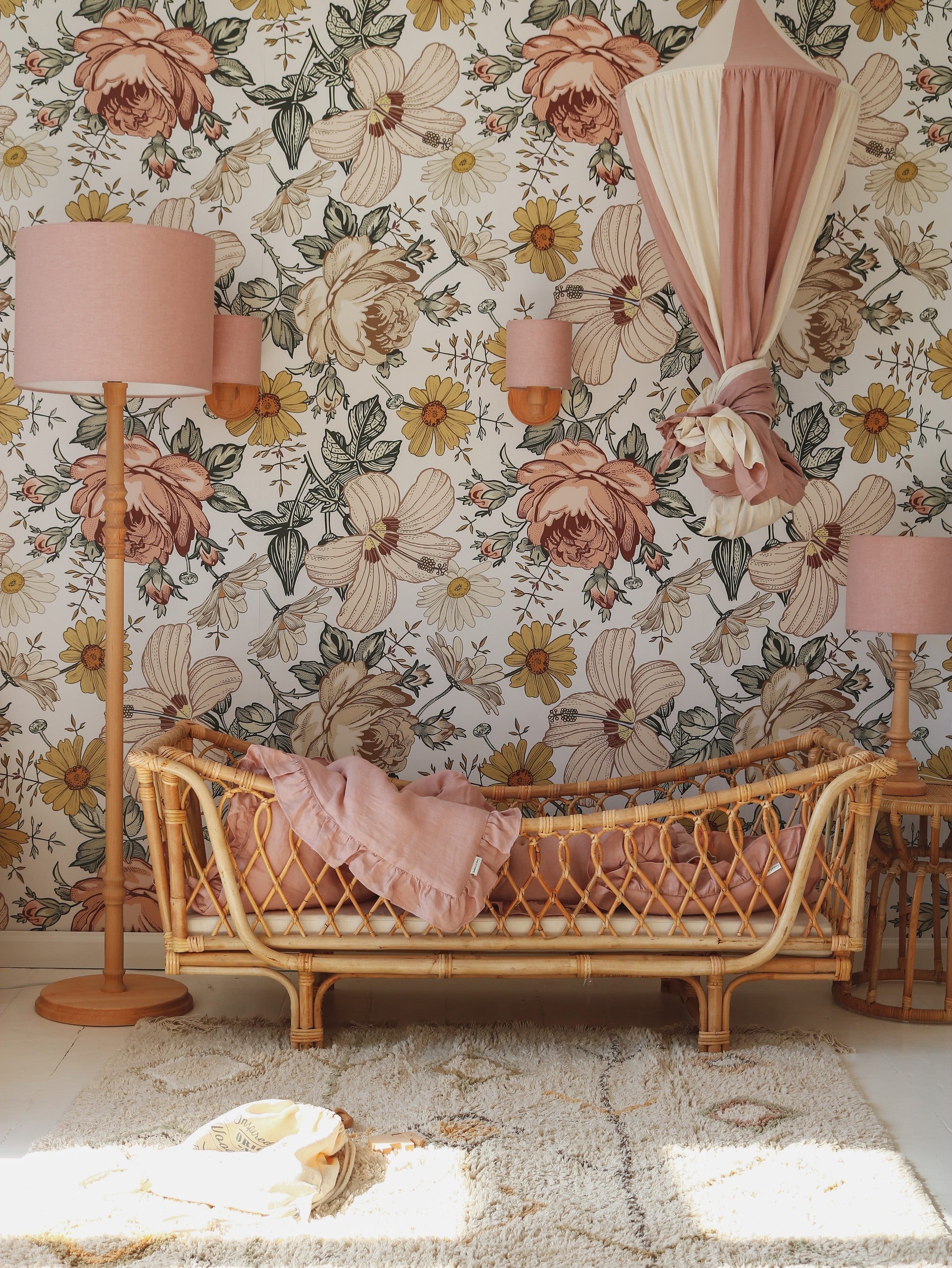 powder pink organic cotton linen canopy hanging over a child's bed with soft morning light