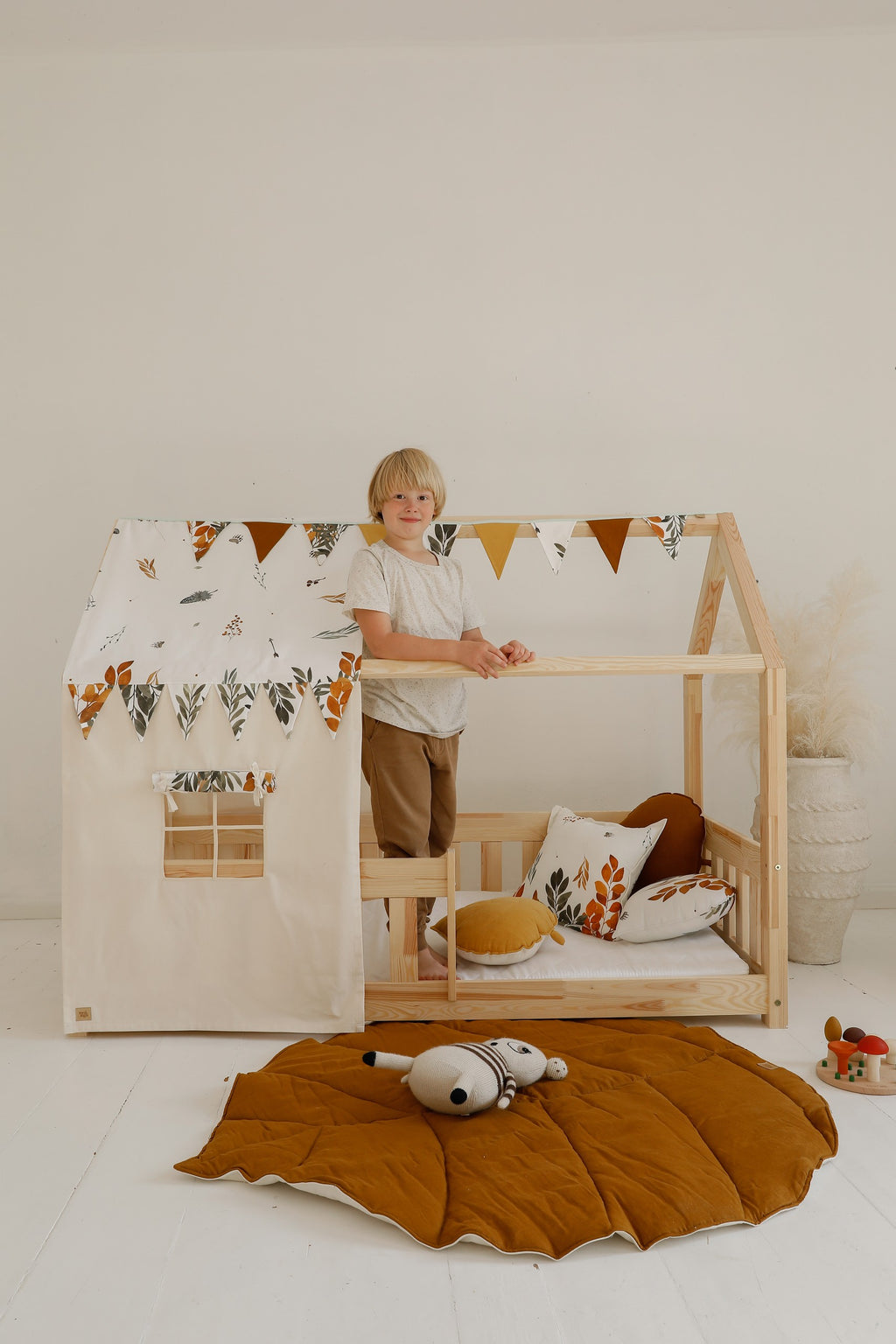 functional caramel leaf playmat in a bright nursery setting, showcasing its spacious 110x120cm size