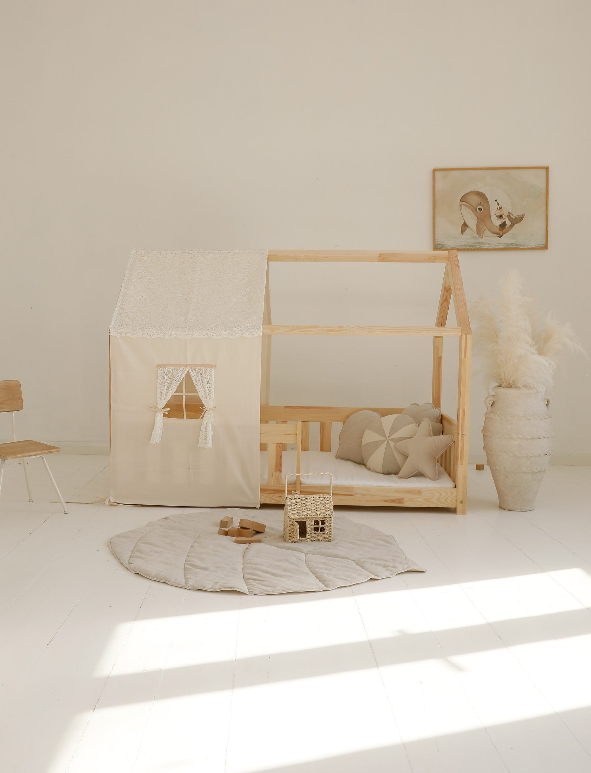a playful ginkgo leaf playmat in sand, tossed on the floor for a spontaneous indoor picnic adventure