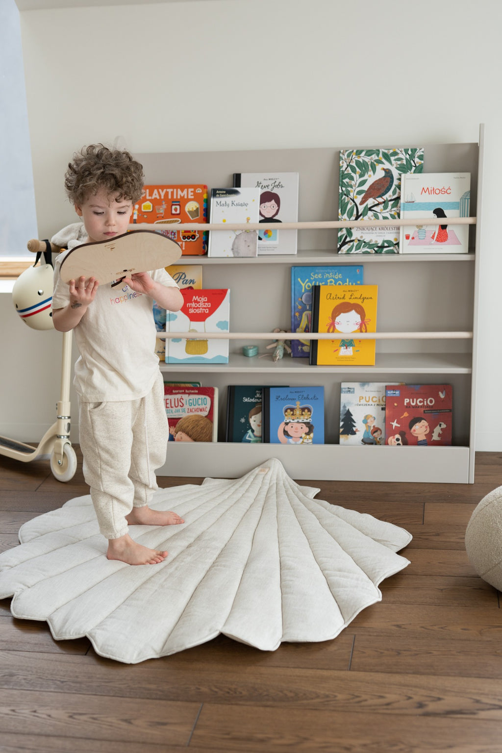bold ginkgo leaf playmat in sand on a clean white background, showcasing its modern shape