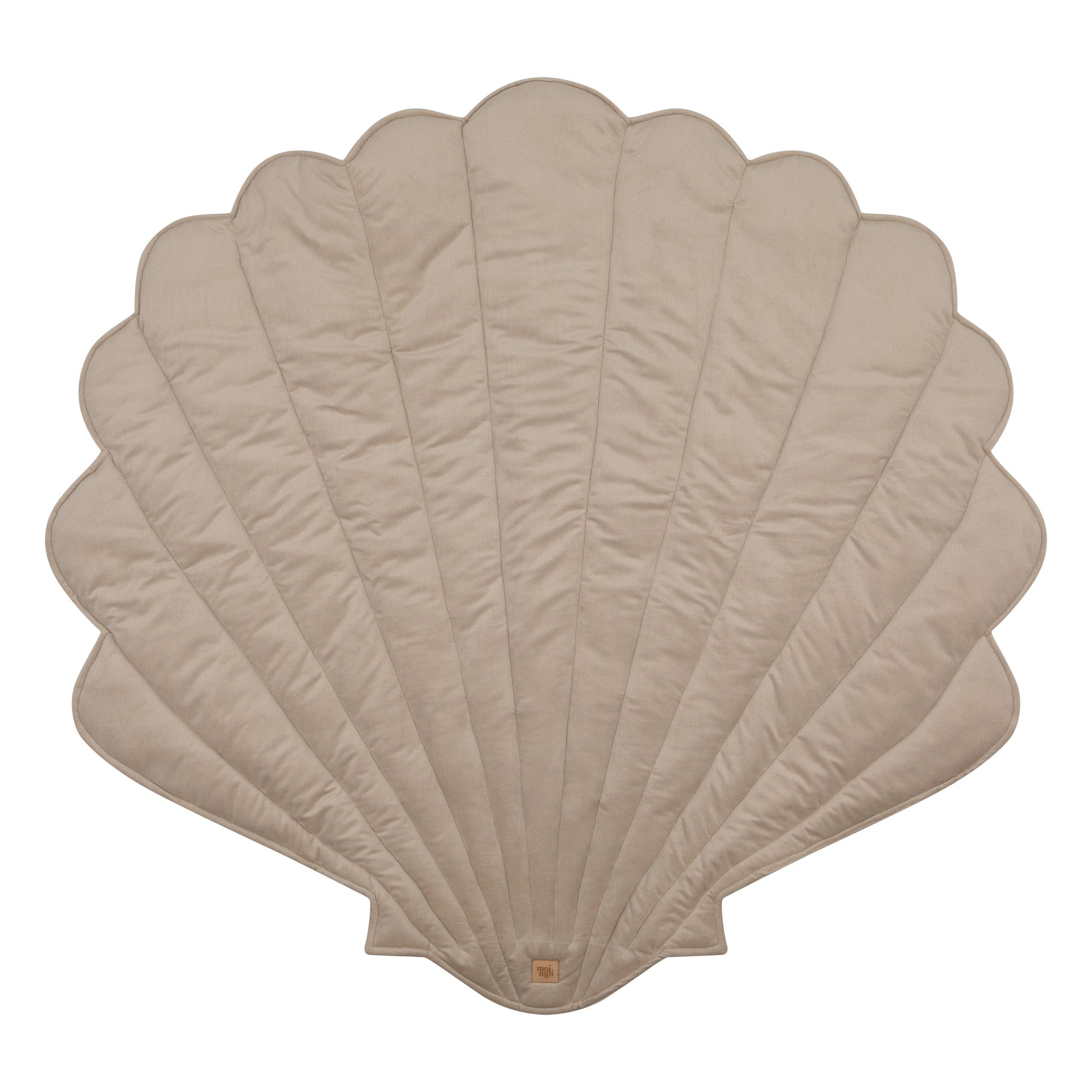 elegant beige ginkgo leaf playmat in a refined living room setting, showcasing its plush velvet texture and artisan craftsmanship