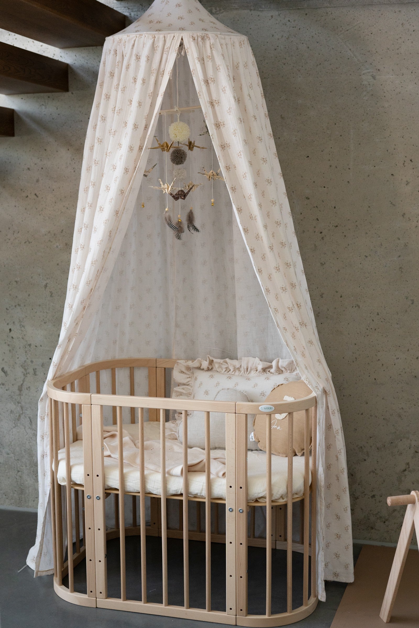 elegant boho flower canopy in mint cotton, draped gracefully over a bed with soft natural light