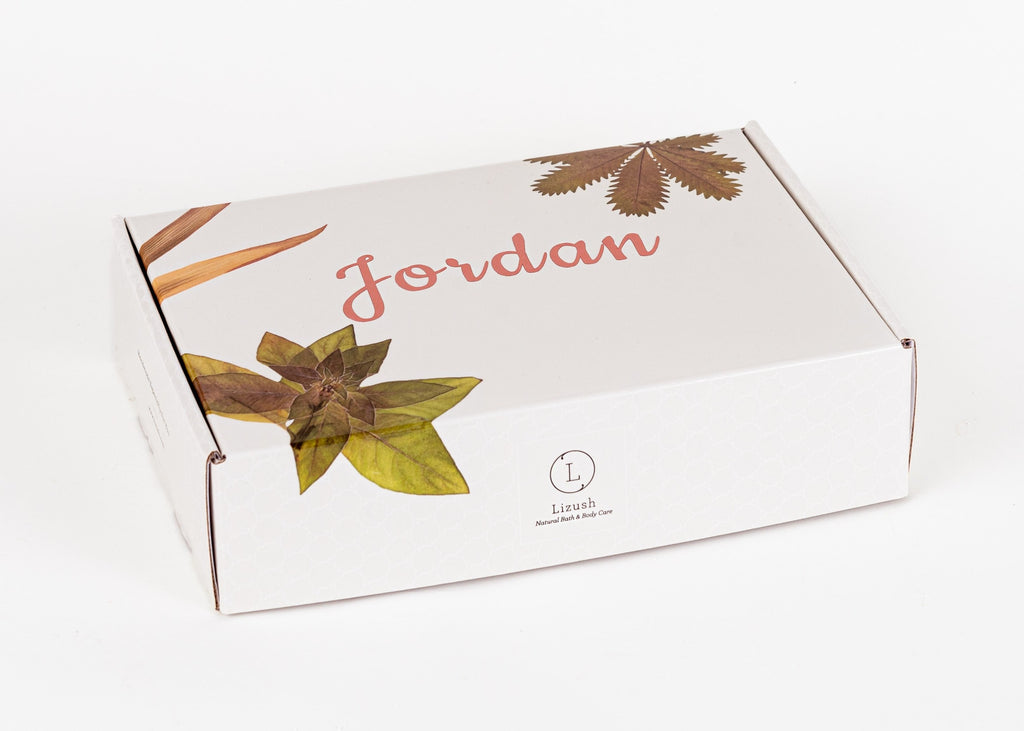 artisan-crafted organic baby gift set with balm and dribble bib on a soft linen backdrop