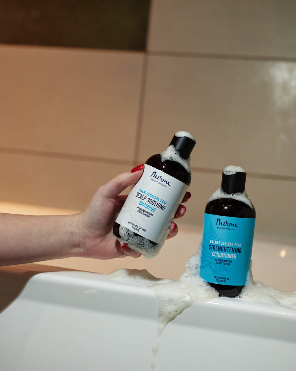 a soft, comforting close-up of nurme's peat conditioner bottle with natural ingredients like aloe vera and jojoba oil