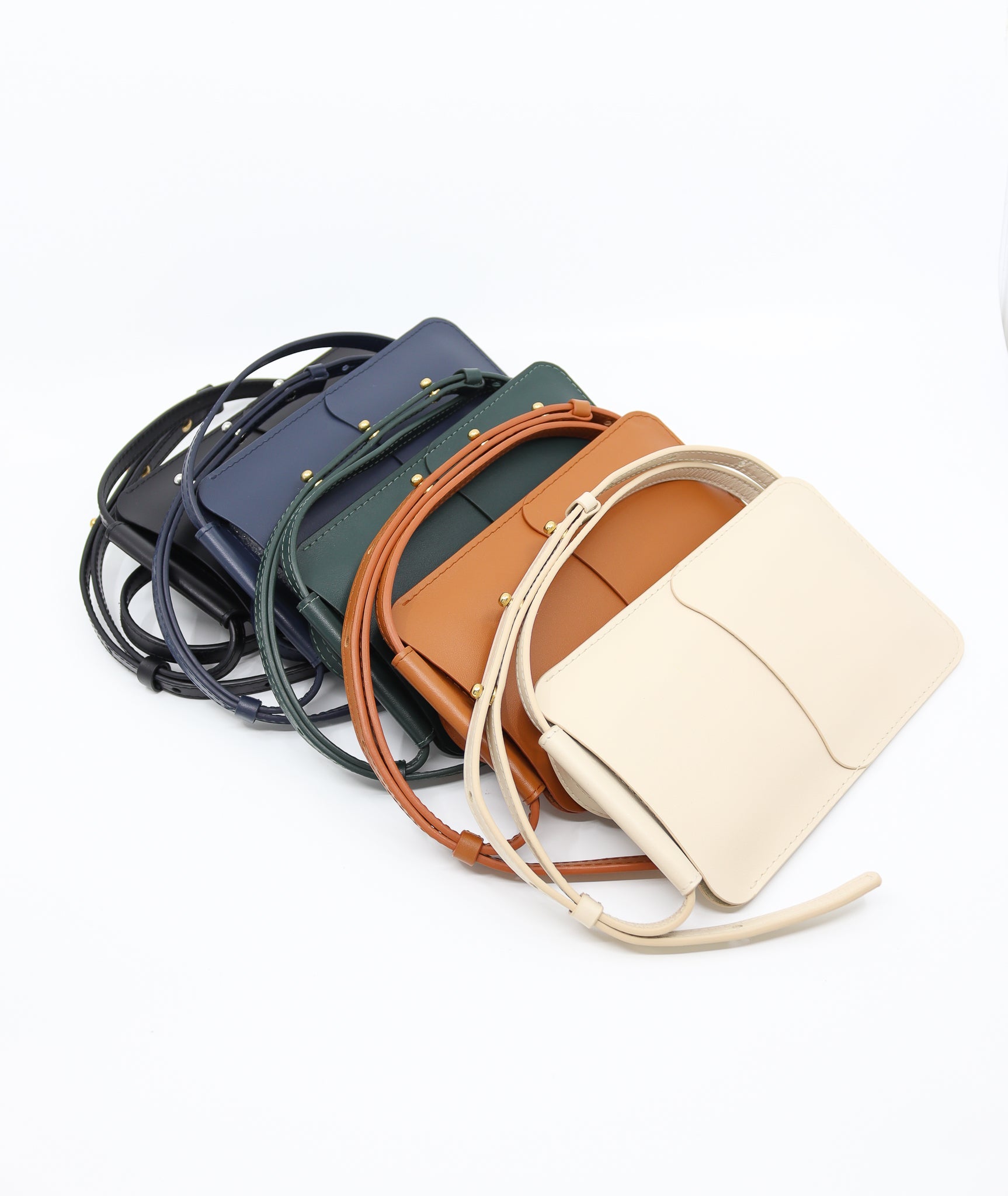 forest green leather crossbody phone bag with adjustable strap and card slots shown from a practical side angle