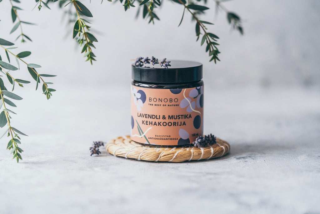 a contemporary leather gift box with four natural body scrubs open for a functional view