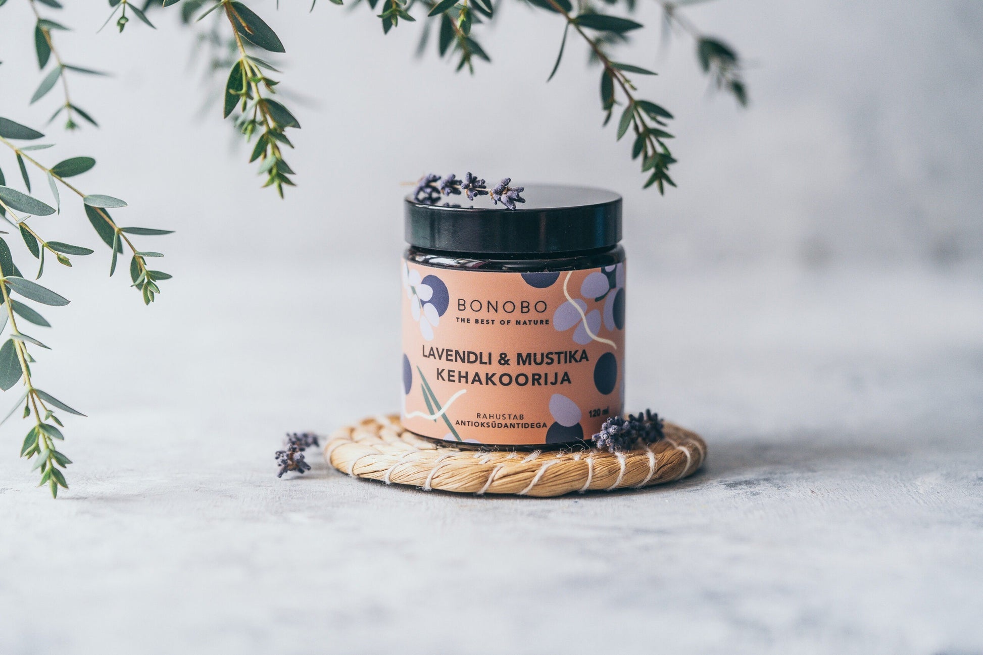 a contemporary leather gift box with four natural body scrubs open for a functional view