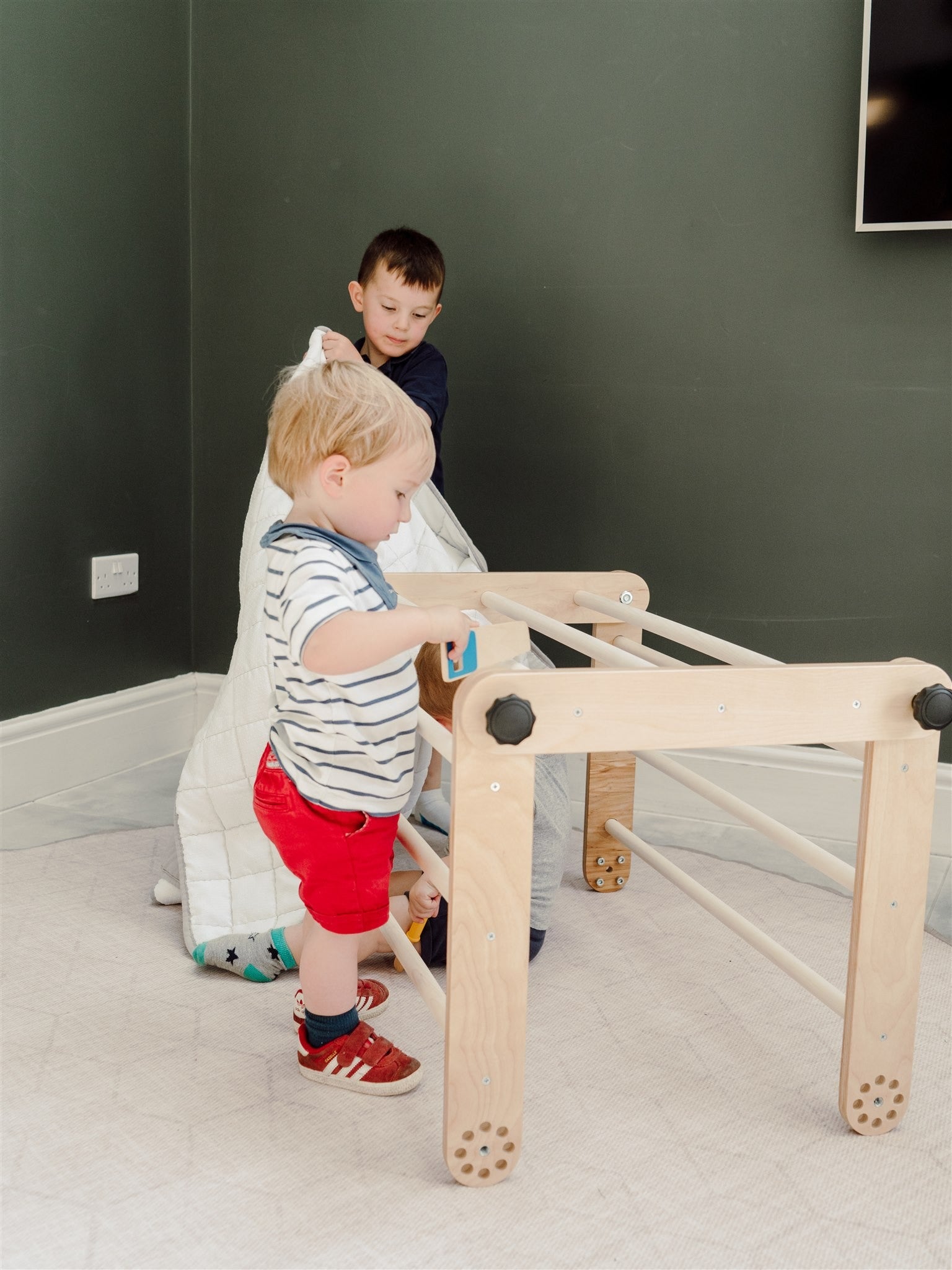 elegant birch pikler triangle in a modern nursery setting
