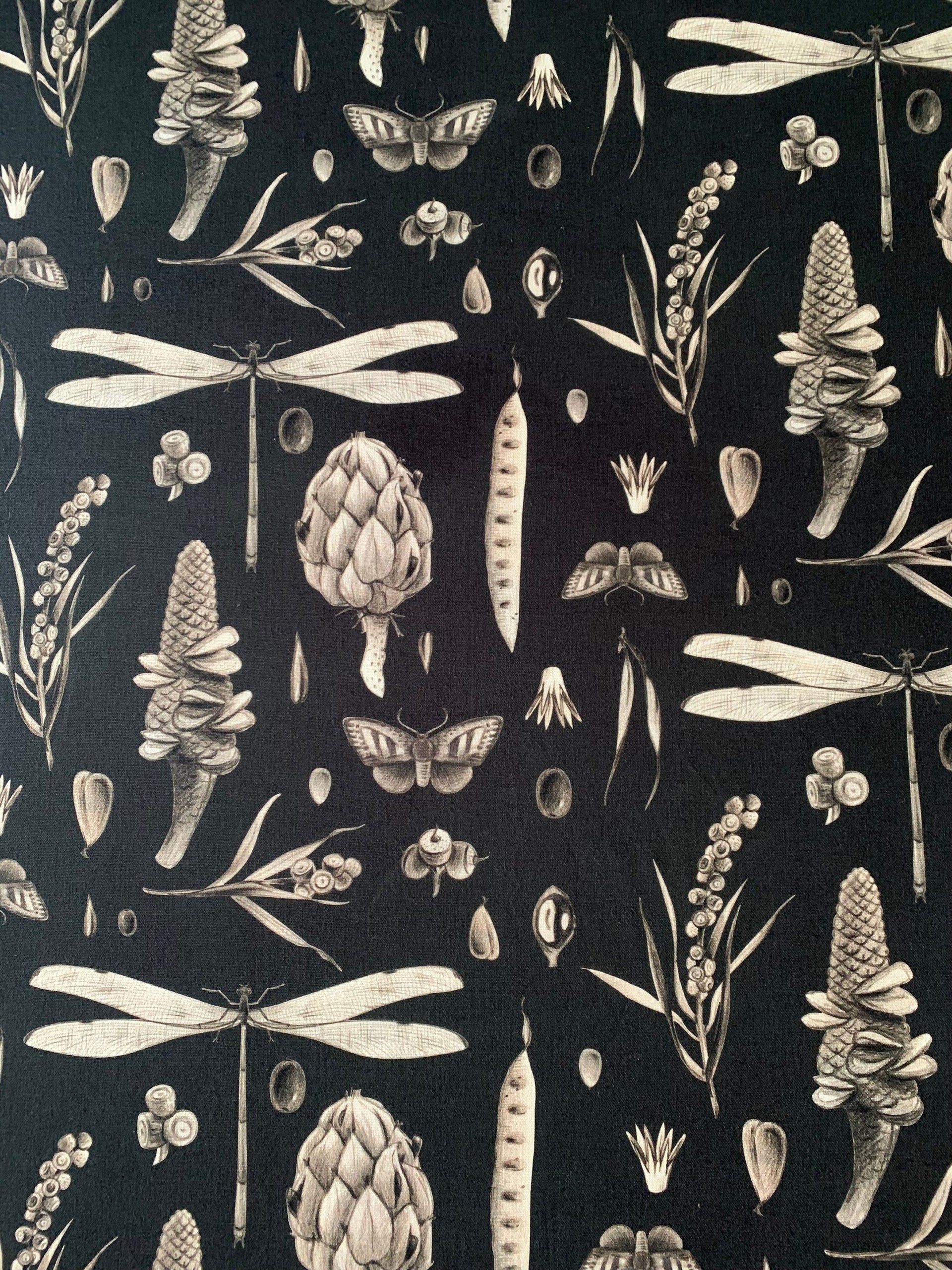 bold charcoal seeds print cotton pillowcase on a minimalist dark sofa