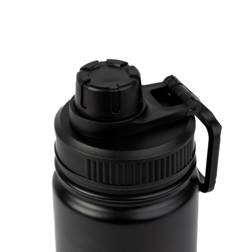 a soft-focus shot of the matte black pippi thermal bottle resting on a cozy wool blanket