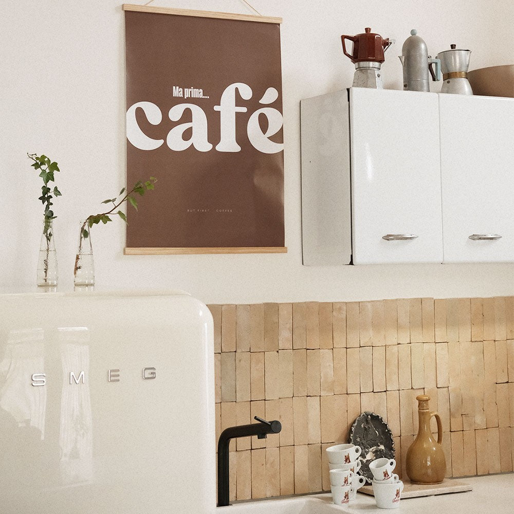 softly lit elegant cafe poster with italian typography on a cozy living room wall