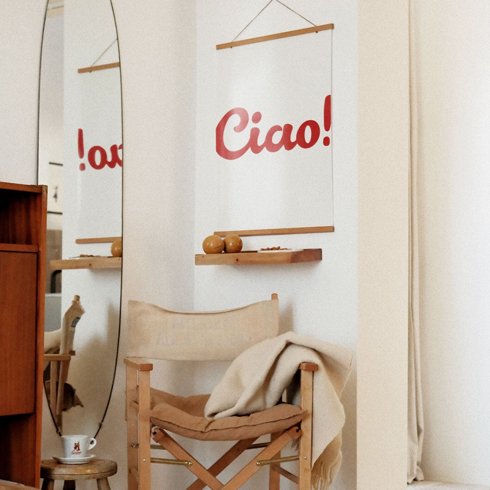 softly lit minimalist ciao poster with warm morning light on its matte paper