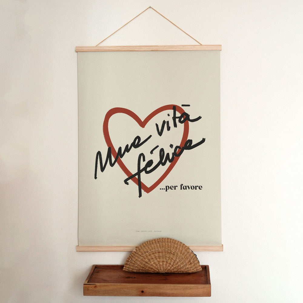 bold vita felice poster in dramatic lighting on a modern dark wall