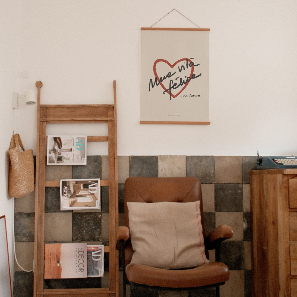 vita felice poster on a playful yellow wall in a bright, cheerful kitchen