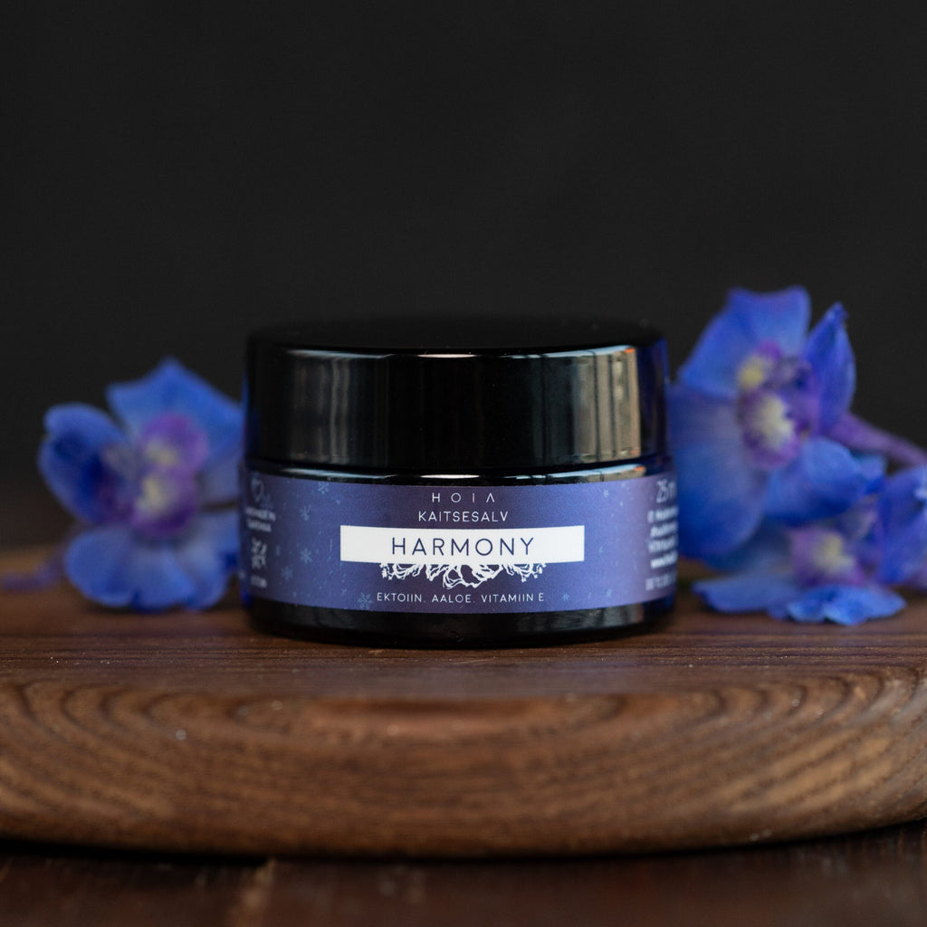 a soft-focus close-up of protective skin balm with ectoine, glowing gently in warm light