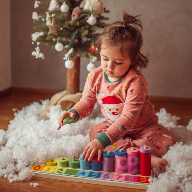 functional kids counting puzzle with 56 wooden pieces arranged by size on a natural wood base