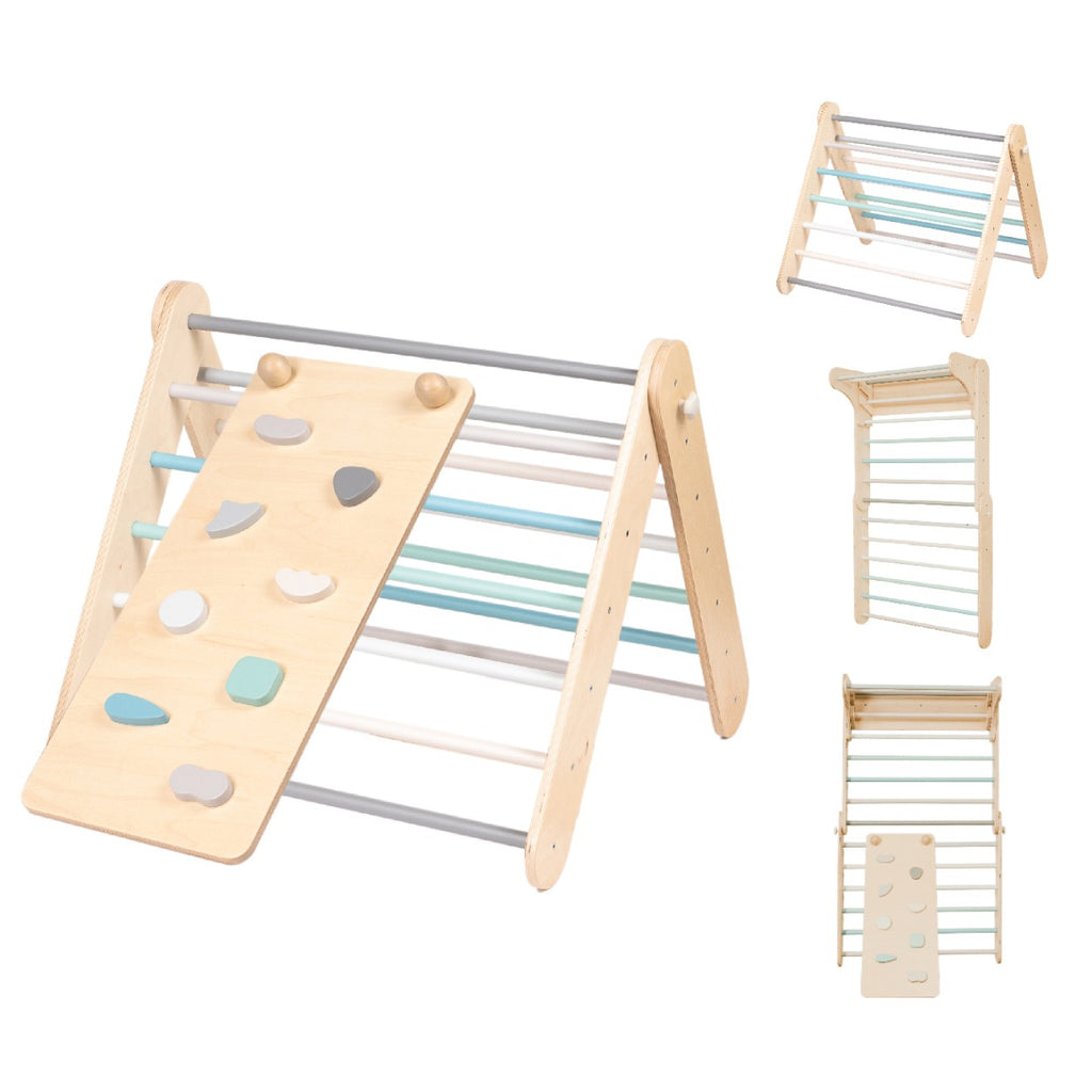 a toddler's hand reaching for a pastel climbing ramp's textured rock hold