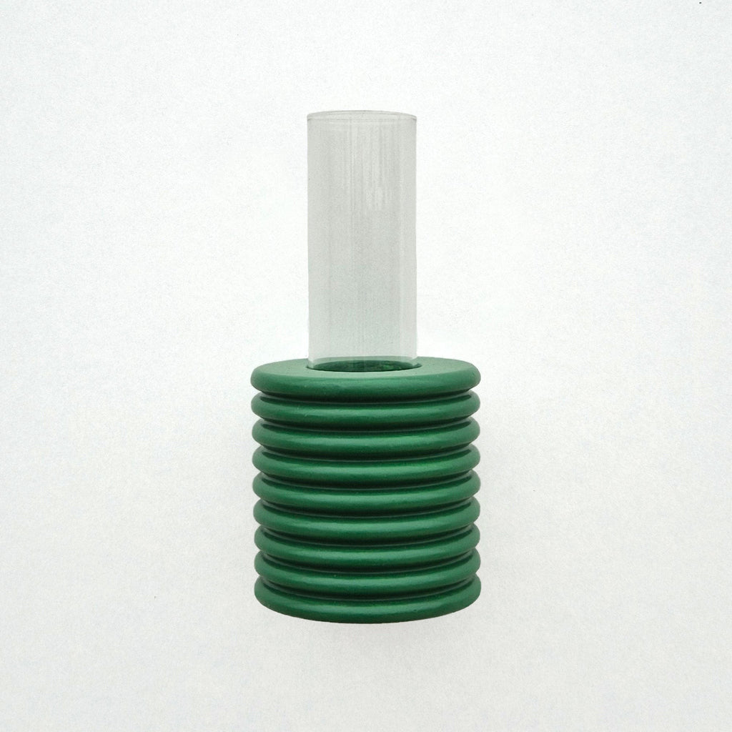 playful green ribble wall vase with a single bright flower on a sunny yellow background