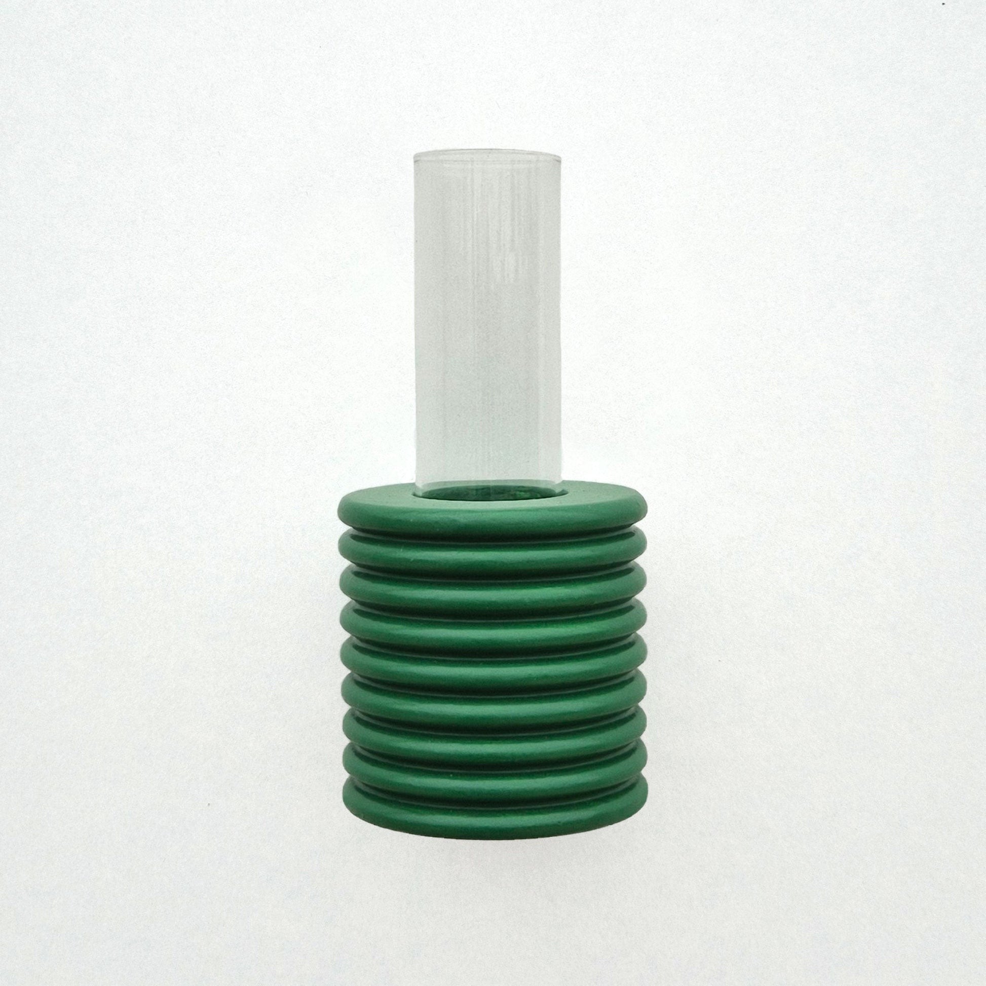 playful green ribble wall vase with a single bright flower on a sunny yellow background