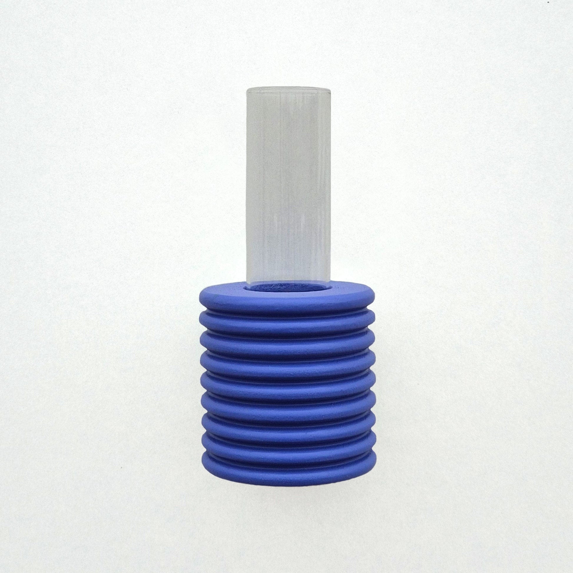playful blue ribble wall vase with a single bright flower on a sunny yellow background