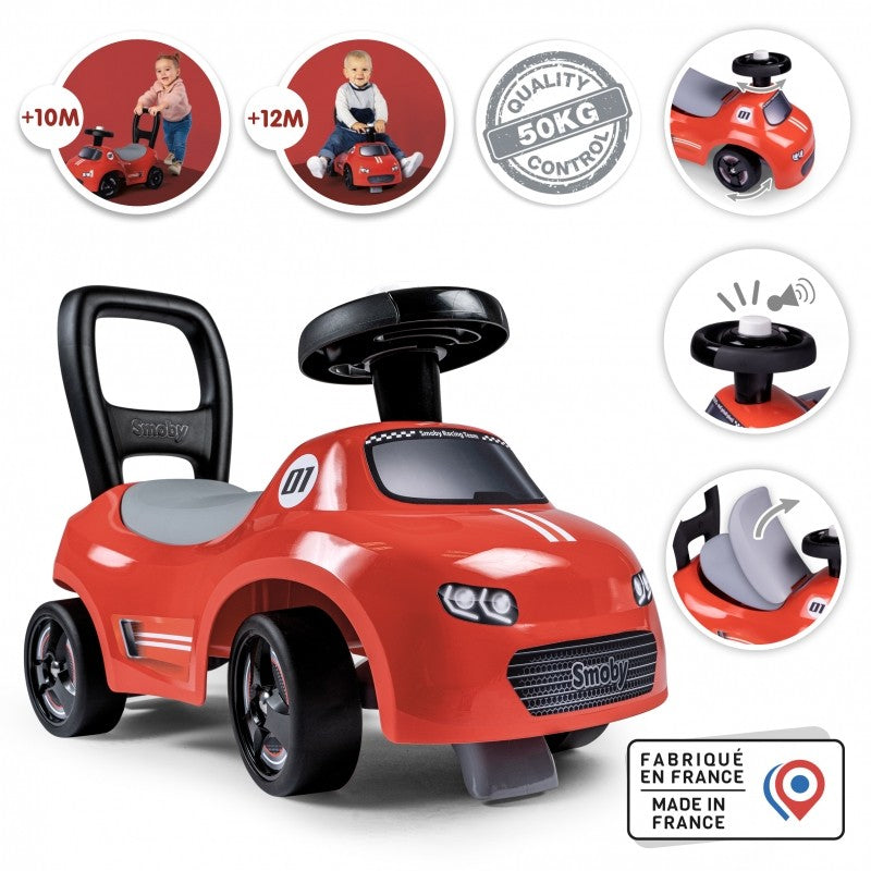 elegant profile of a red smoby ride-on car for kids with a sleek horn and hidden storage