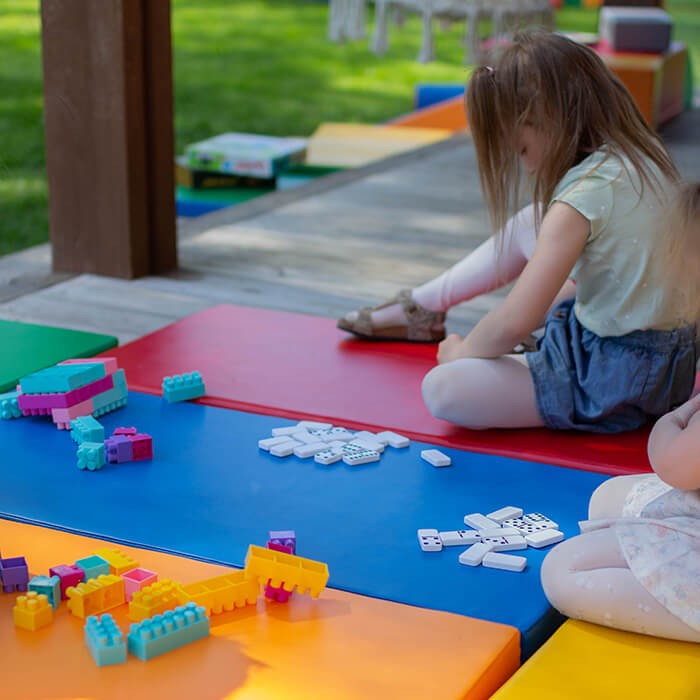 elegant arrangement of iglu's multicolor play mats for a refined nursery space