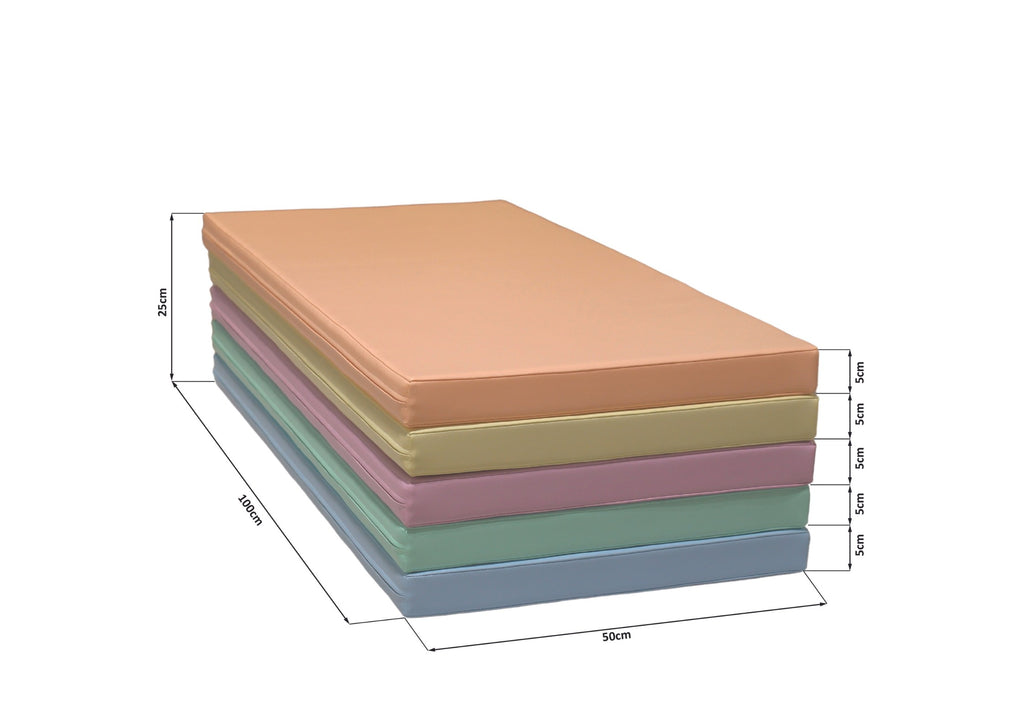 close-up of a soft pastel iglu play mat on a nursery floor in warm morning light