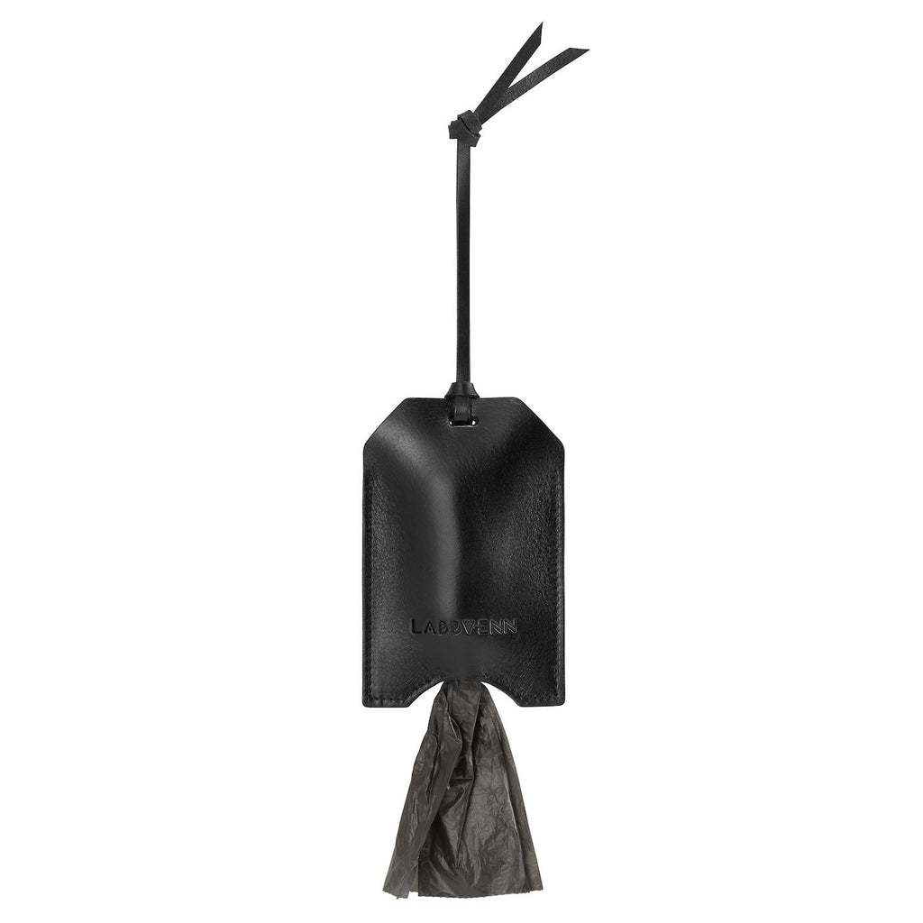 bold black italian leather dog bag dispenser held confidently in hand