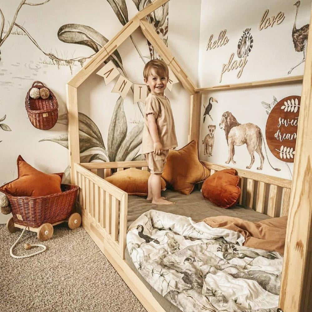 bold savanna wonderland wallstickers set featuring a majestic giraffe and lion family in soft pastel botanical style
