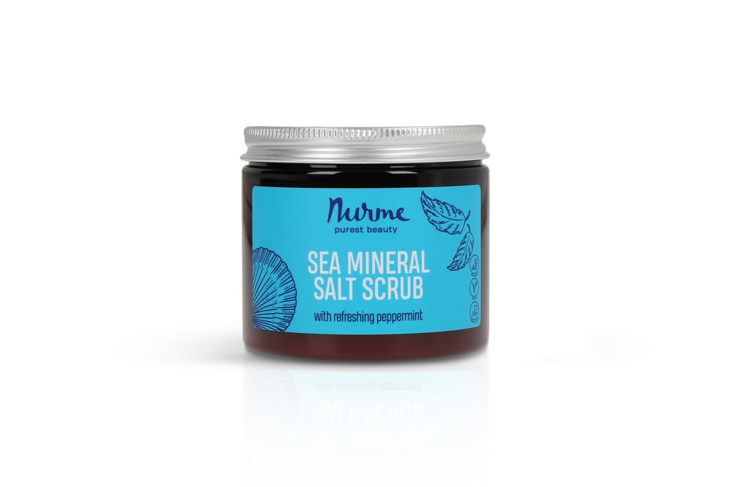 a close-up of nurme's sea mineral body scrub with soft morning light highlighting its creamy texture