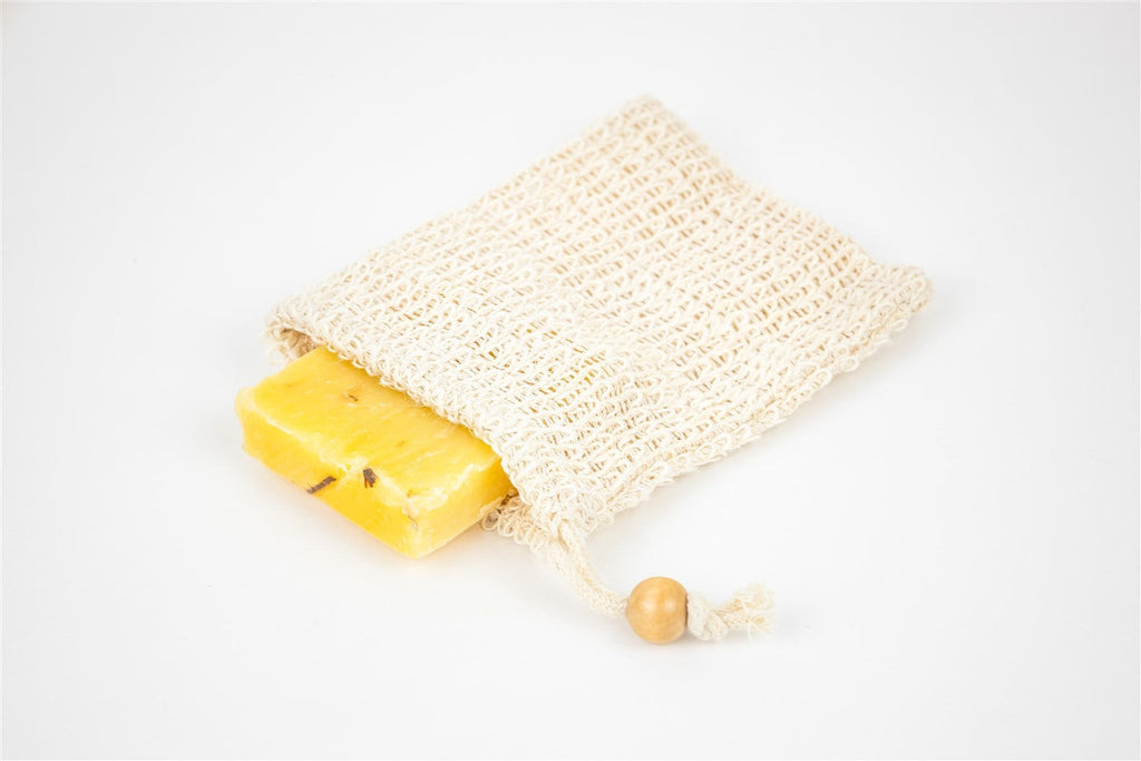 luxury spa gift set contents laid out practically showing eucalyptus soap, foot cream, and mug